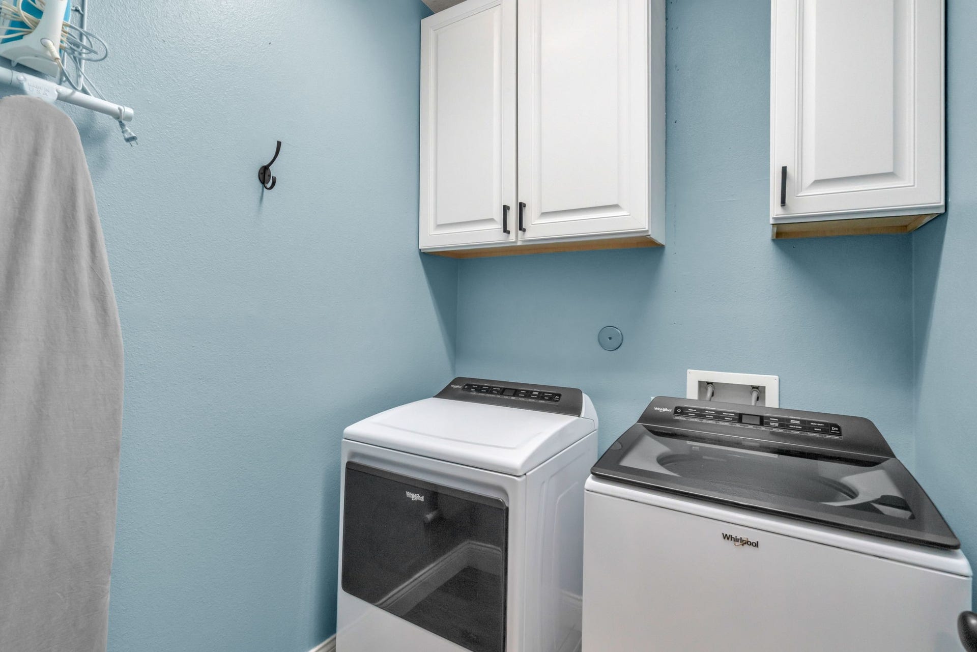 Laundry room with storage. Washer and dryer are included.