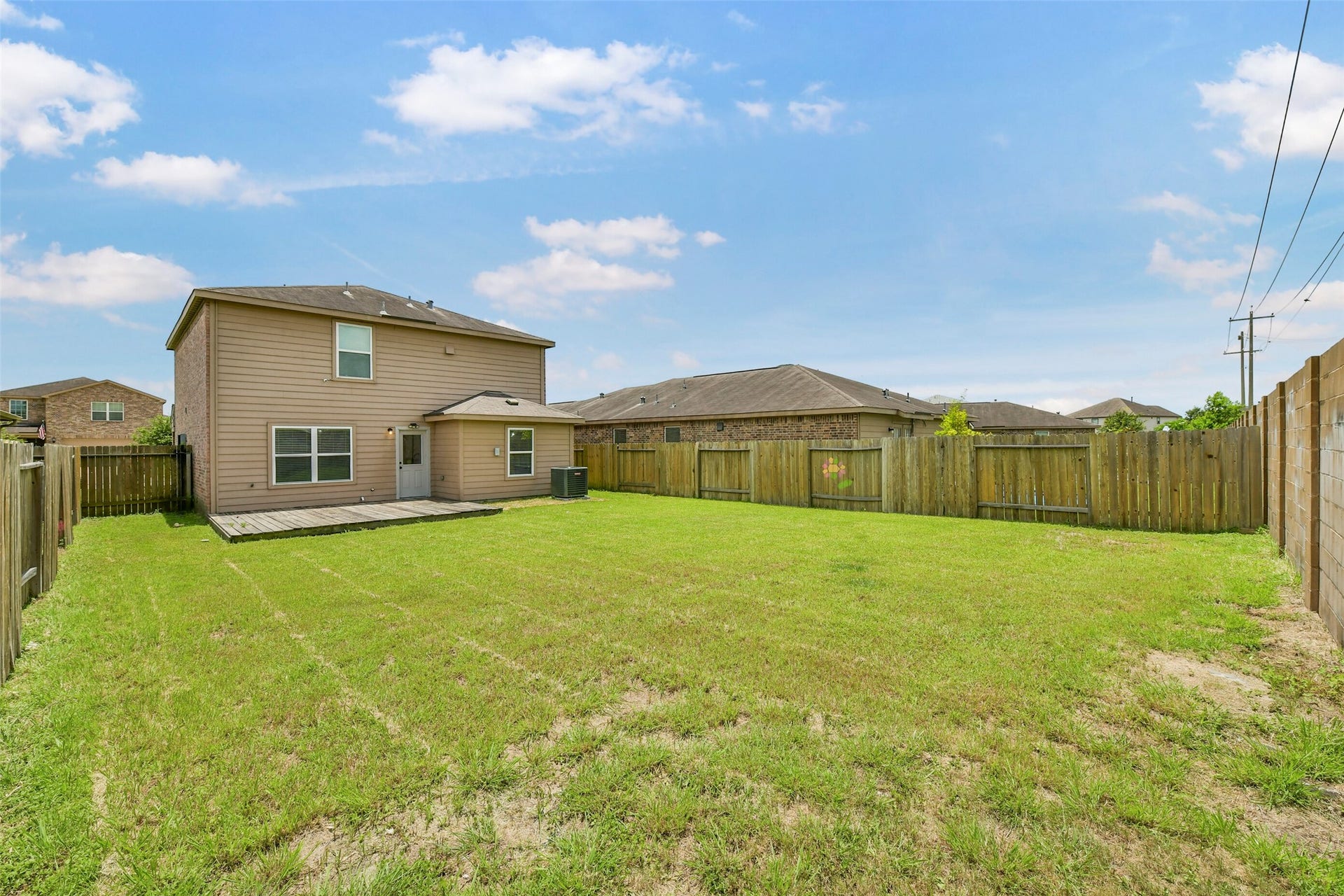 2921 Seacrest Lane, La Marque, TX 77568 Fully enclosed backyard offering privacy and space for outdoor enjoyment.