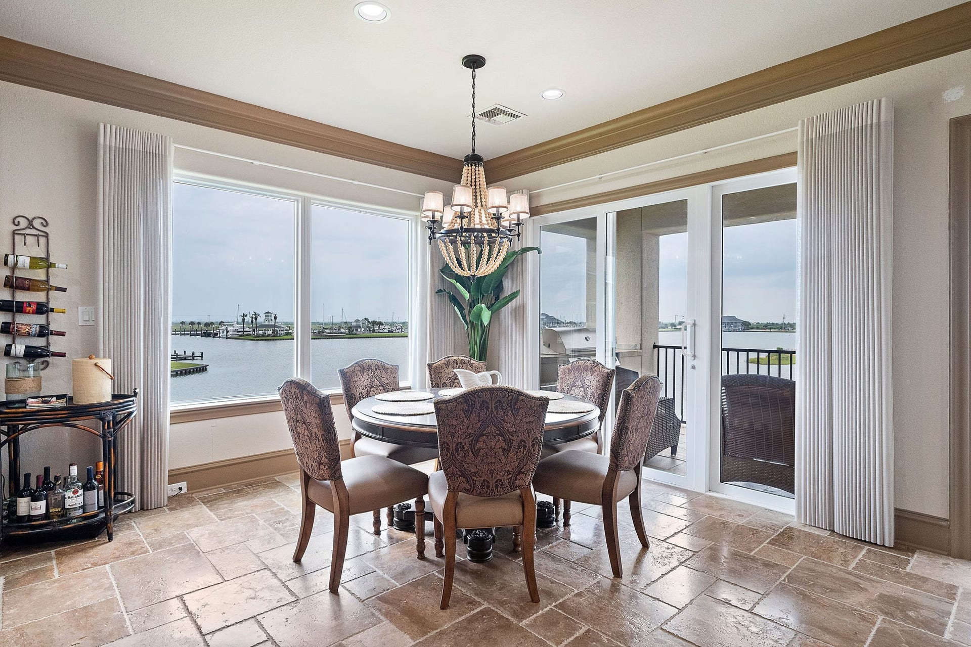 21 Loggerhead, Hitchcock, TX 77563 The dining area offers captivating views of Harborwalk Marina and the Marina Channel