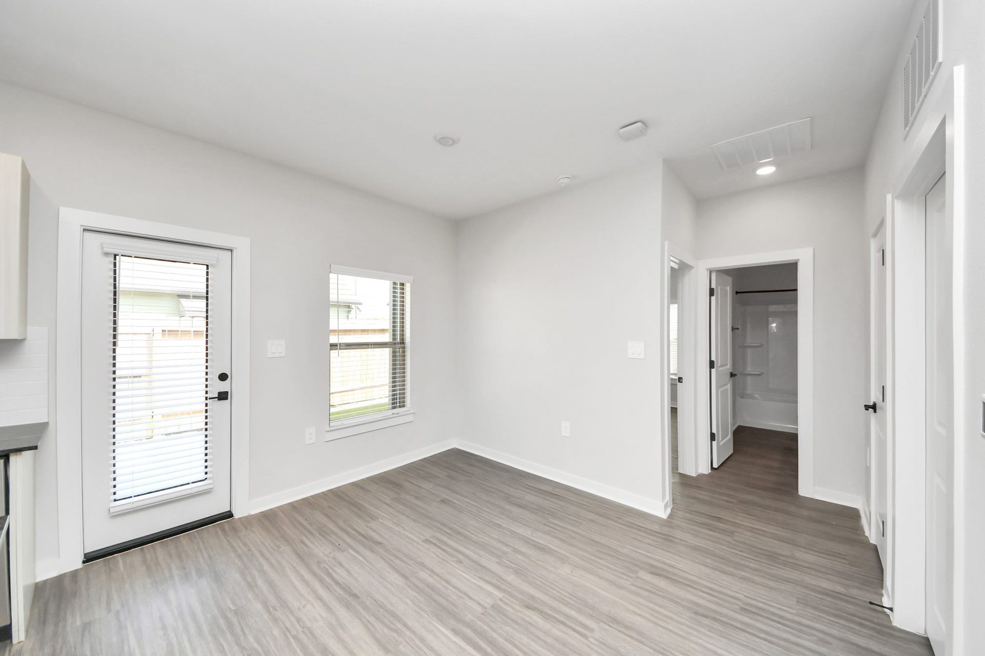 Open Concept Floor Plan with wood-like floors throughout!