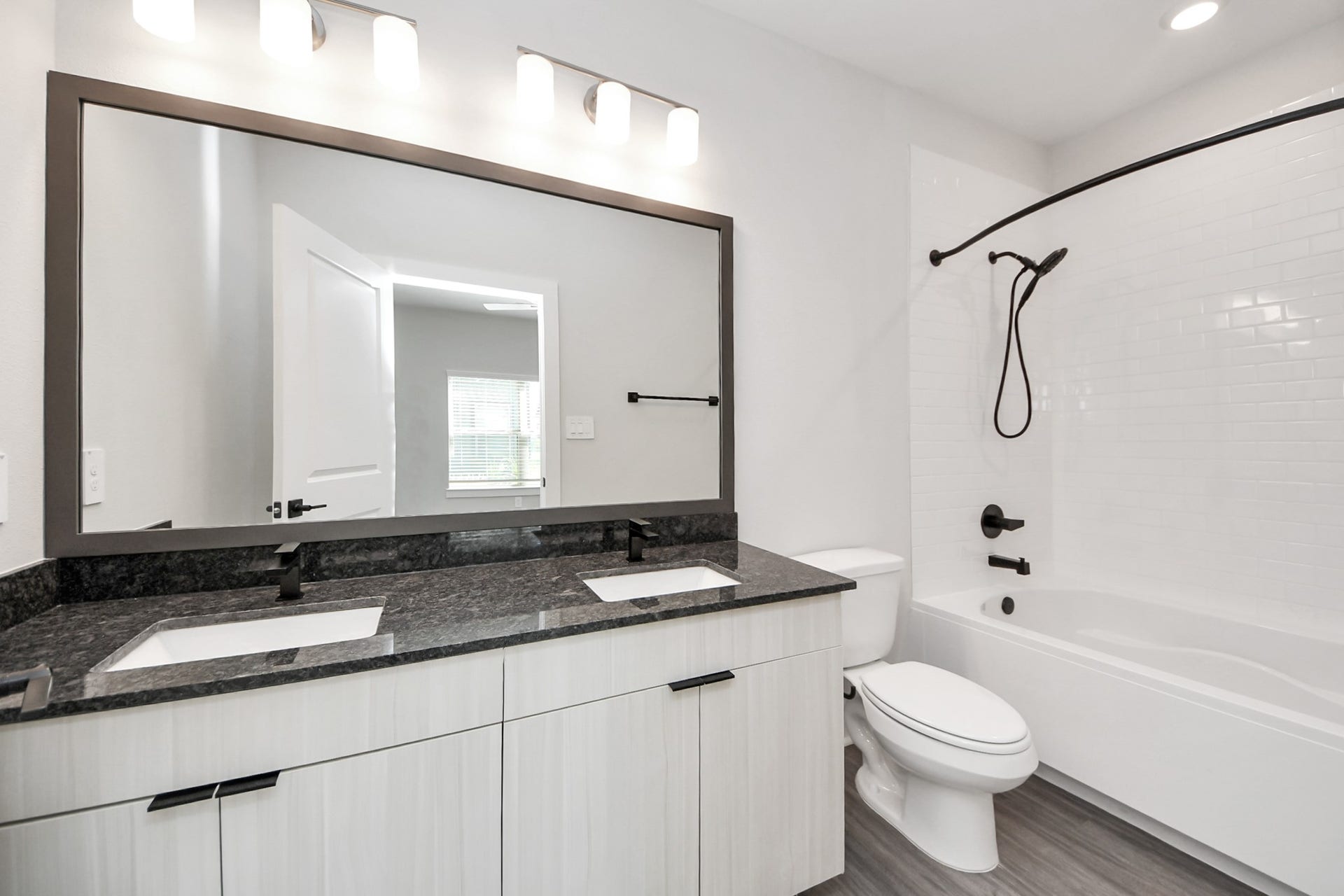 Primary Suite offers walk-closet,bath w/dual vanities&lux tub/shower.