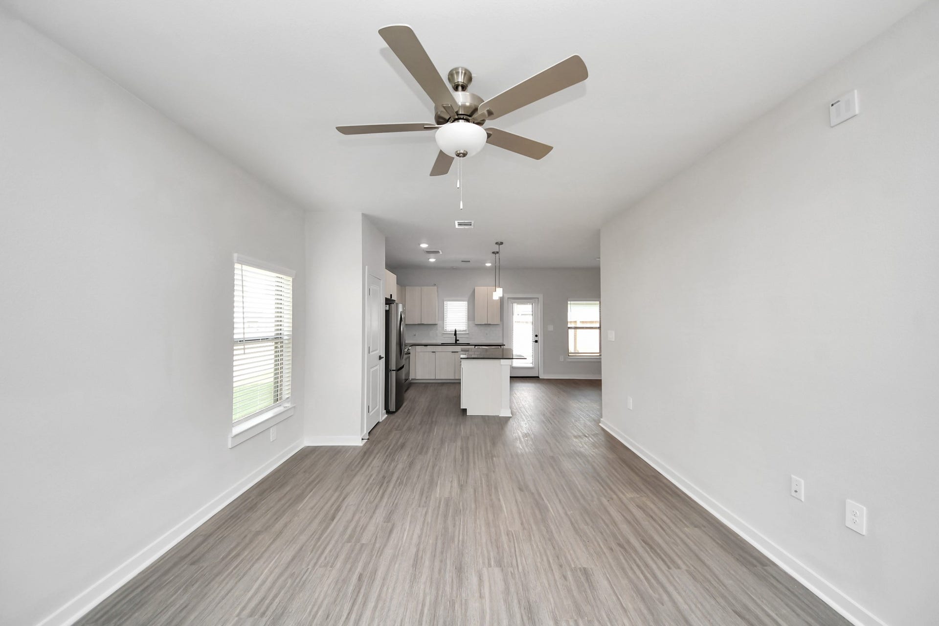 Open Concept Floor Plan with wood-like floors throughout!
