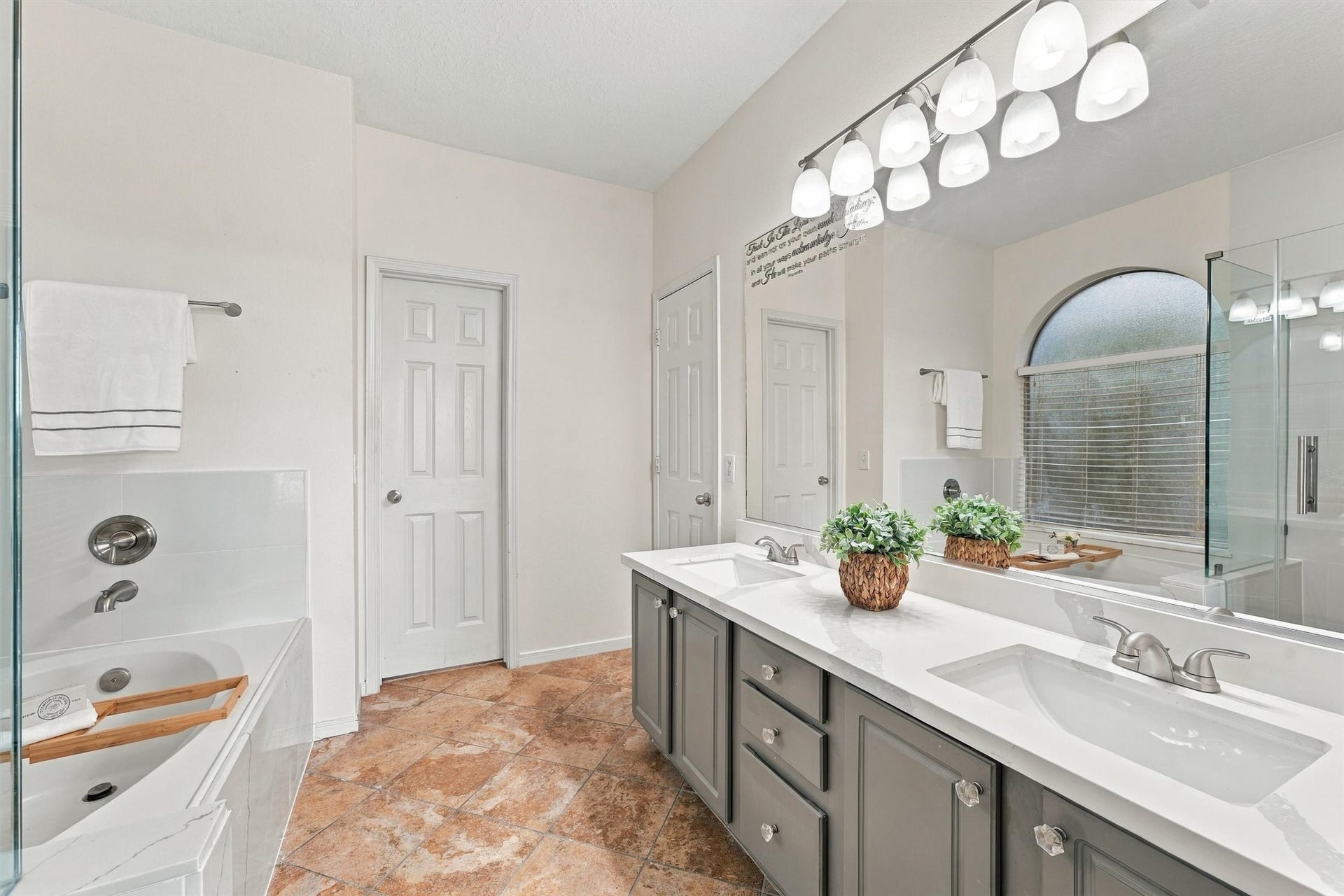 Recently renovated primary bathroom featuring dual sinks, updated finishes, and generous vanity space.