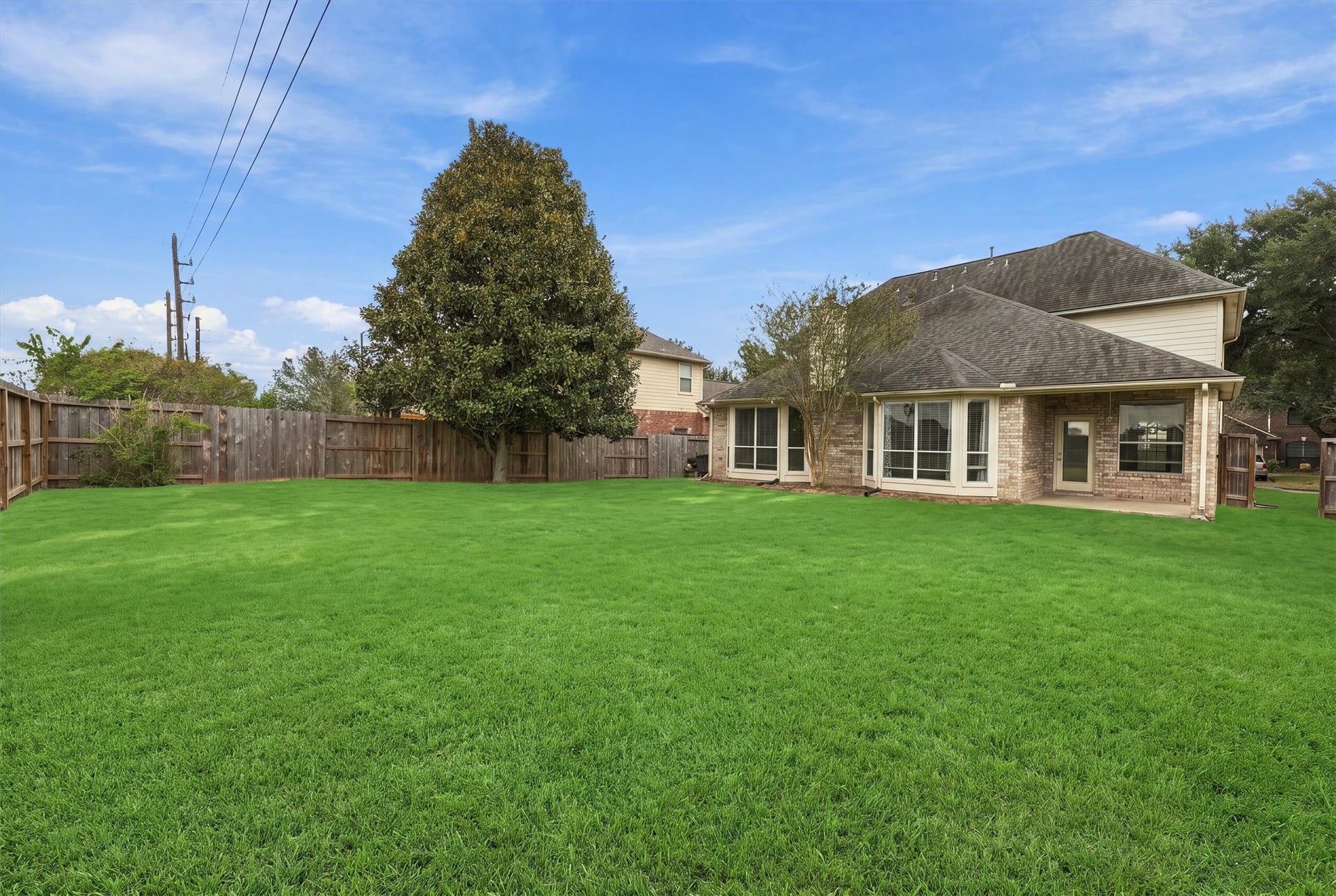 Oversized backyard offering plenty of room for outdoor activities and entertaining.