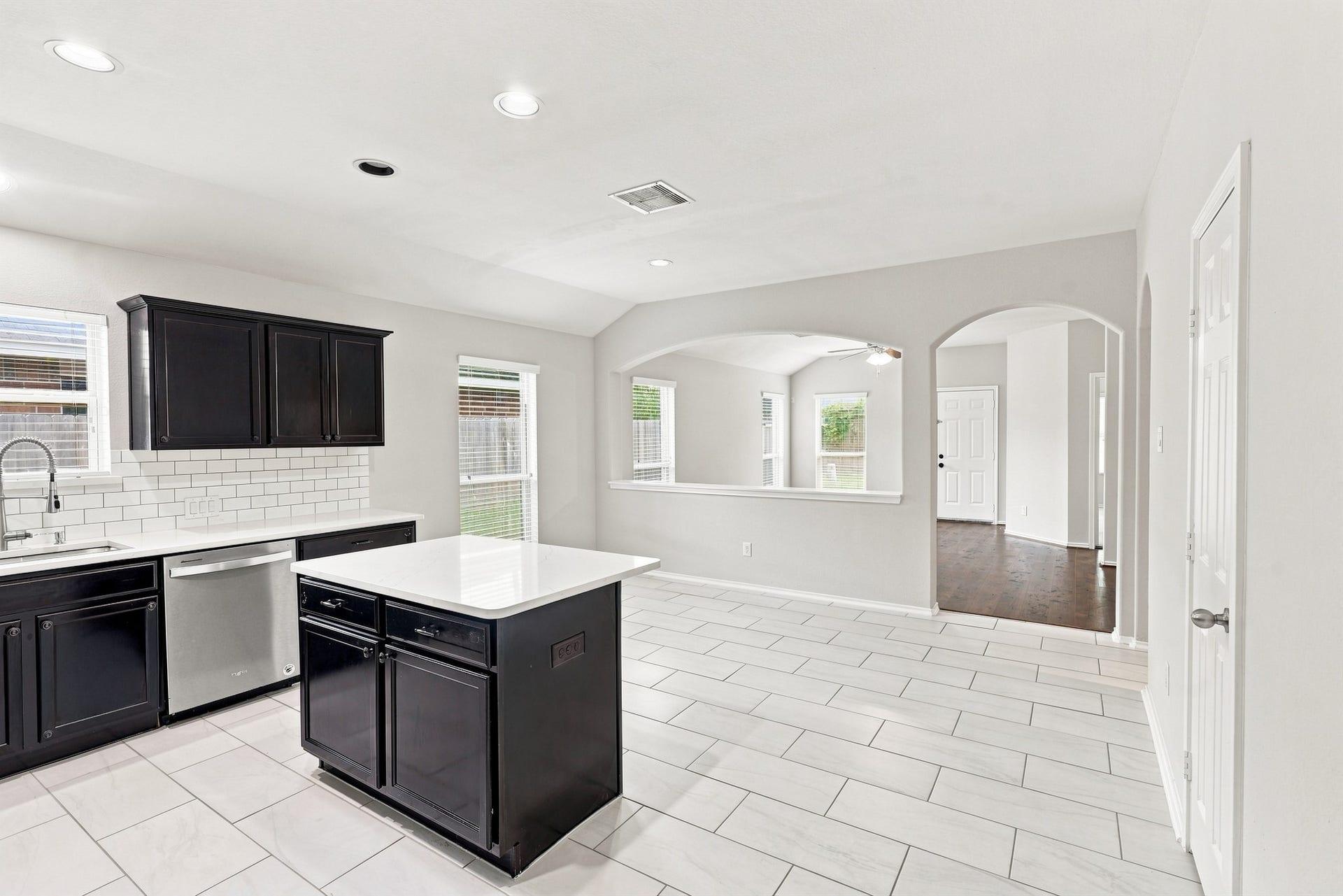 Kitchen and dining area with open sightlines into the adjoining living room