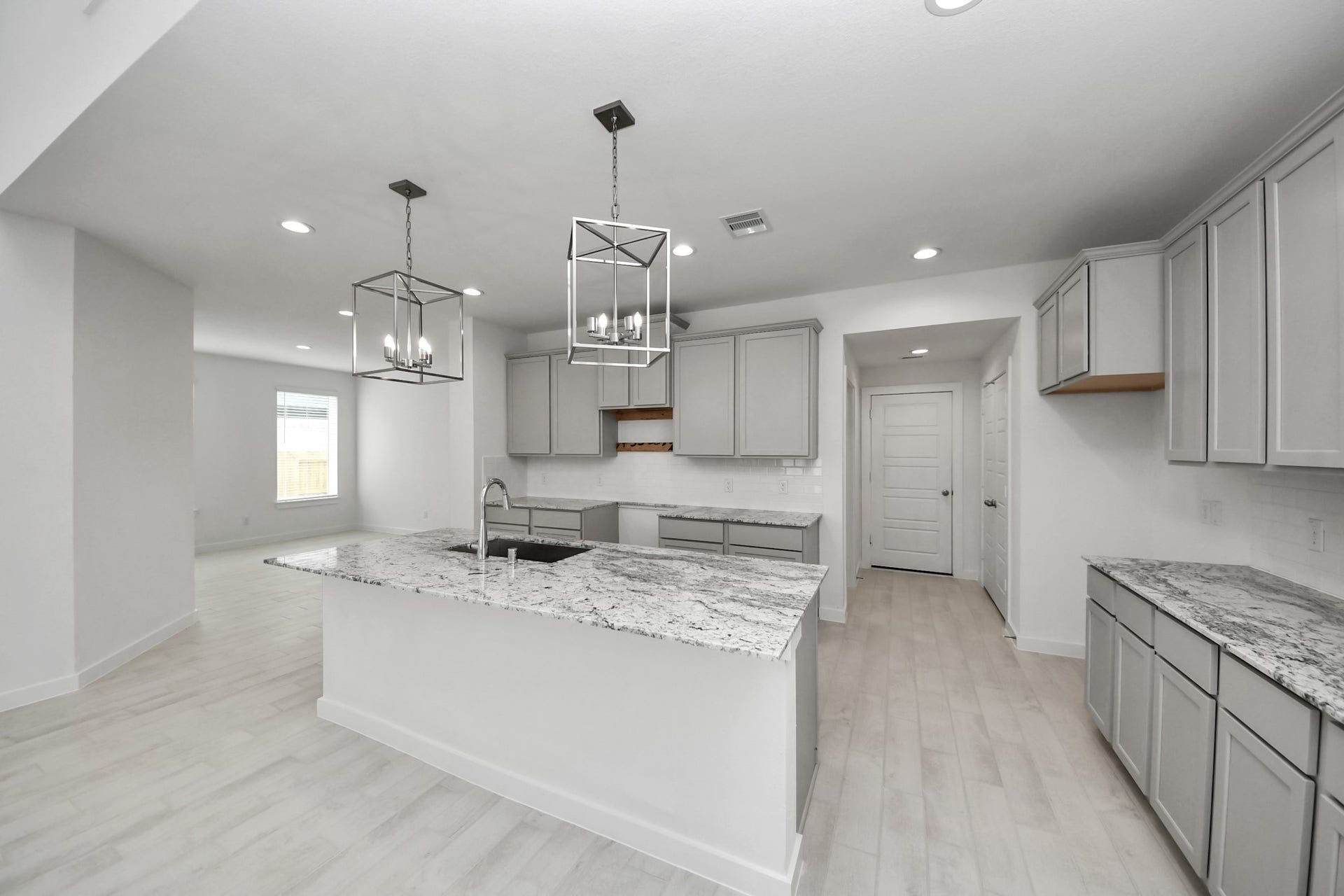 All of this overlooks your expansive family room, creating a perfect space for culinary delights and family gatherings.