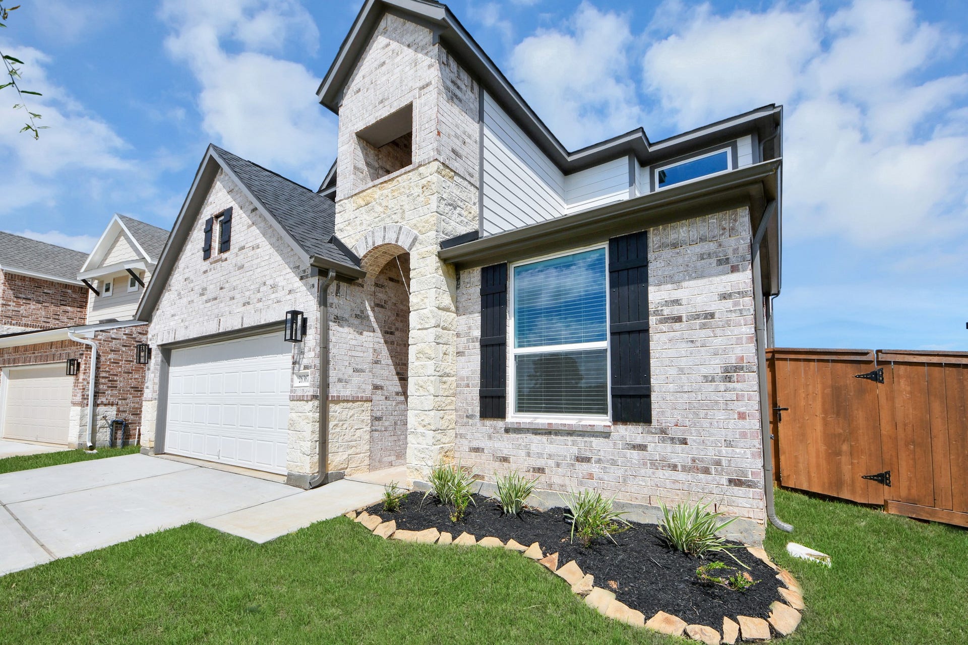Home features a convenient 2-car garage complemented by a spacious driveway, offering ample parking for you and your guests.