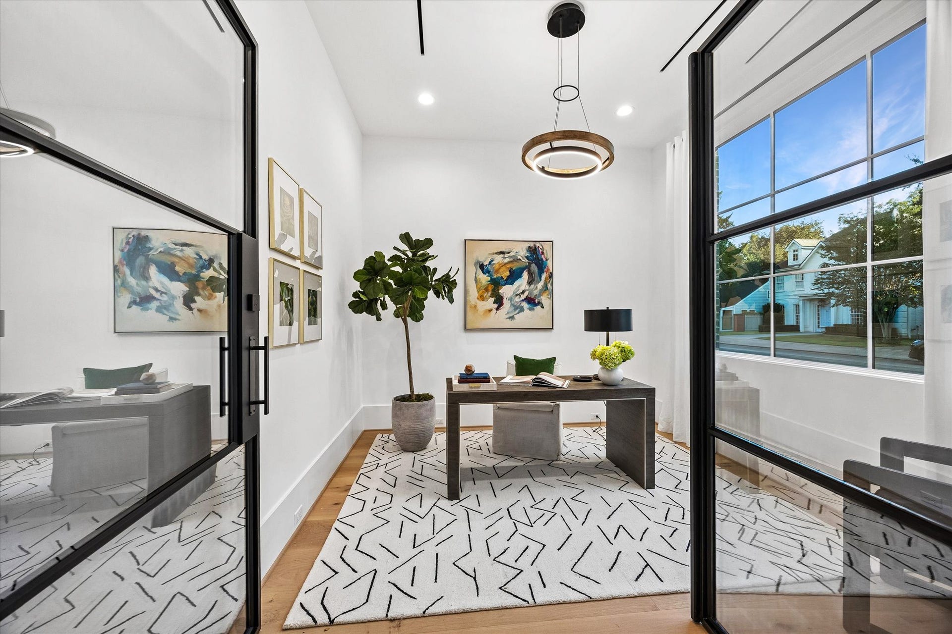 [Home Office/Study] The study features double door entry, sleek linear HVAC diffusers, large window brings in abundant natural light. Overlooks front gardens.