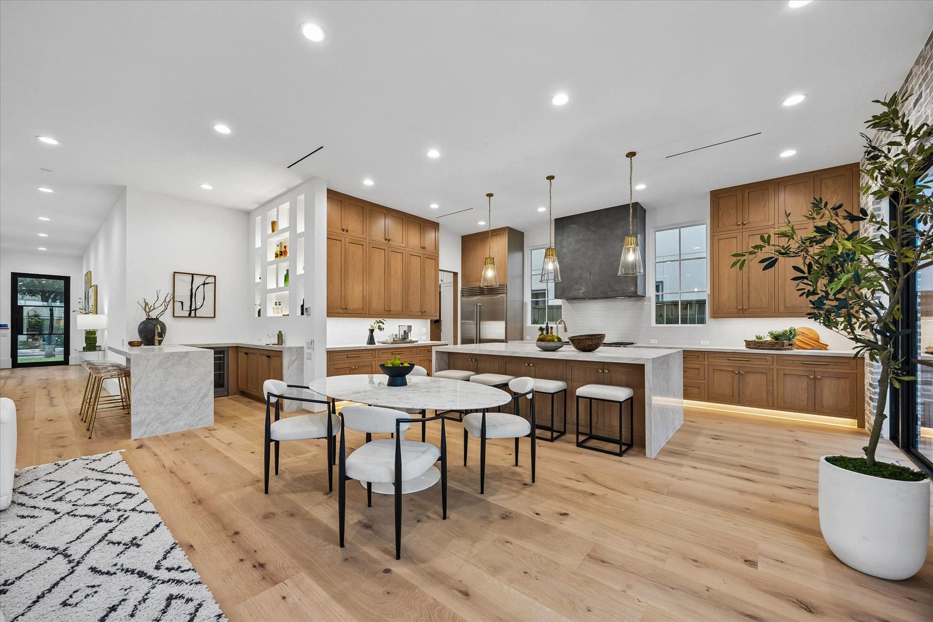 [Breakfast Room] For casual meals, kitchen conversations, and watching the chef do all the work! Positioned next to multiple doors/windows with views of the backyard.