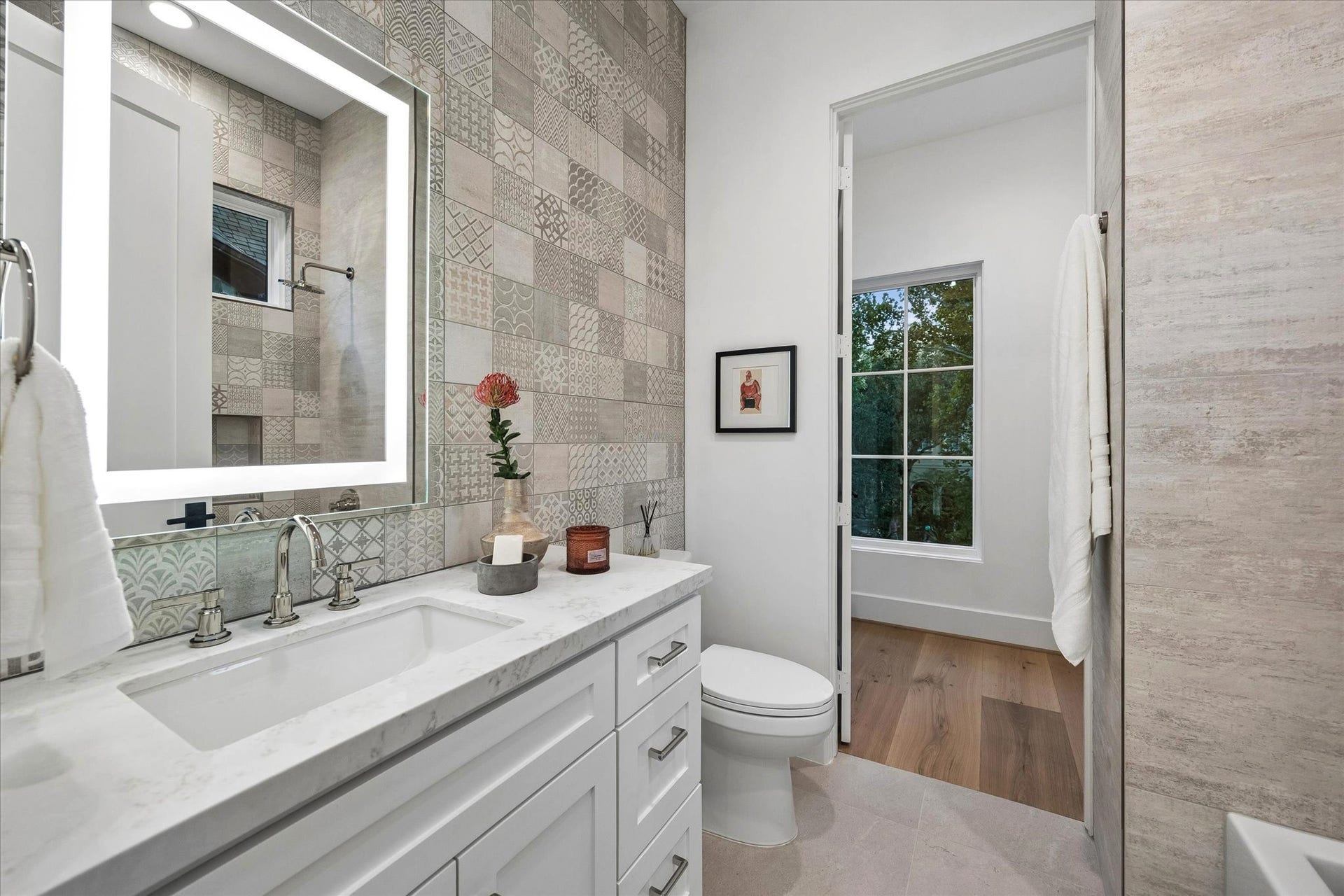 [Secondary Ensuite Bath] All three secondary bedrooms have ensuite  bathrooms with abundant storage.