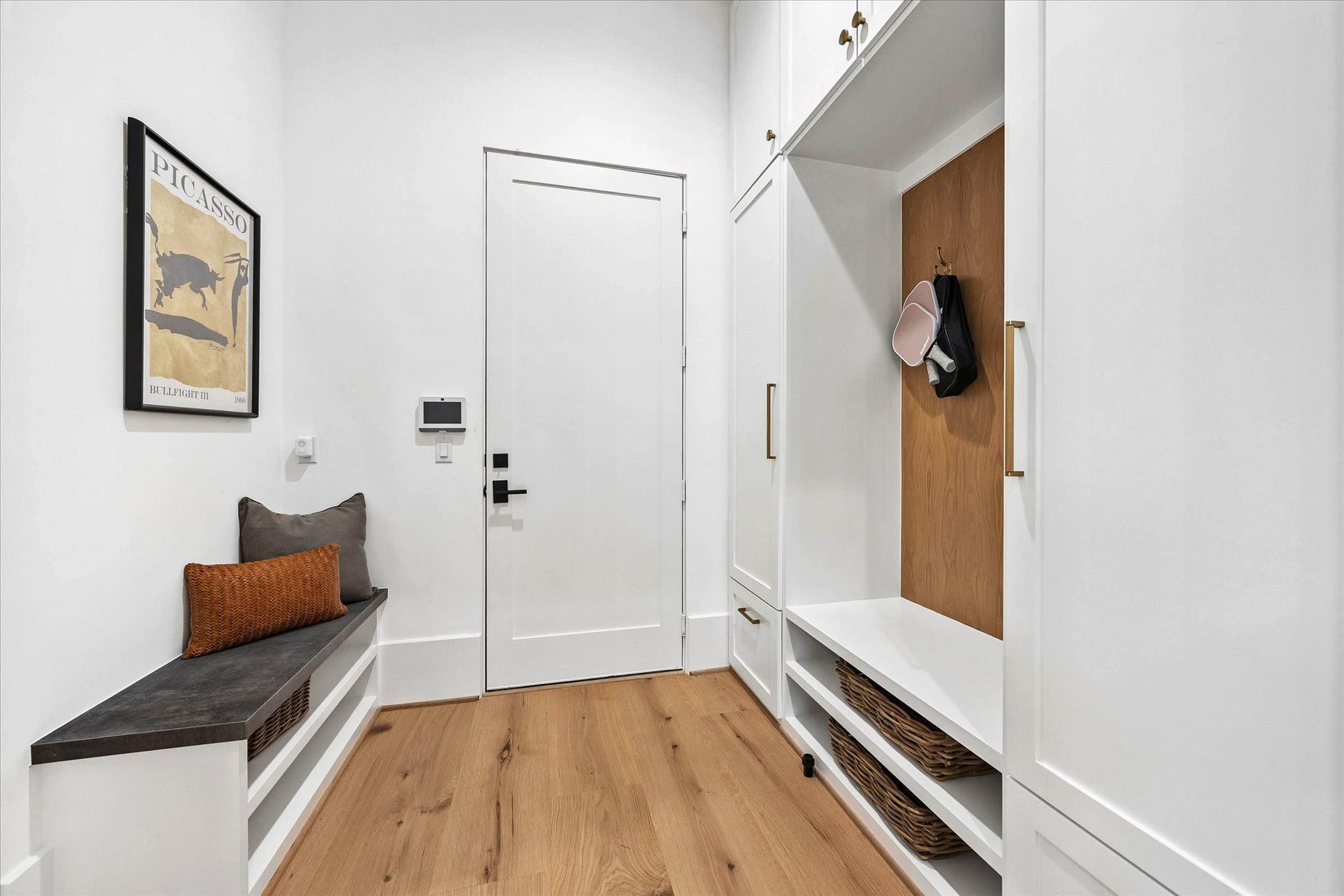 [Mudroom] Off of the garage. Plenty of storage space along with sitting bench. An efficient space that will keep you and your home organized.