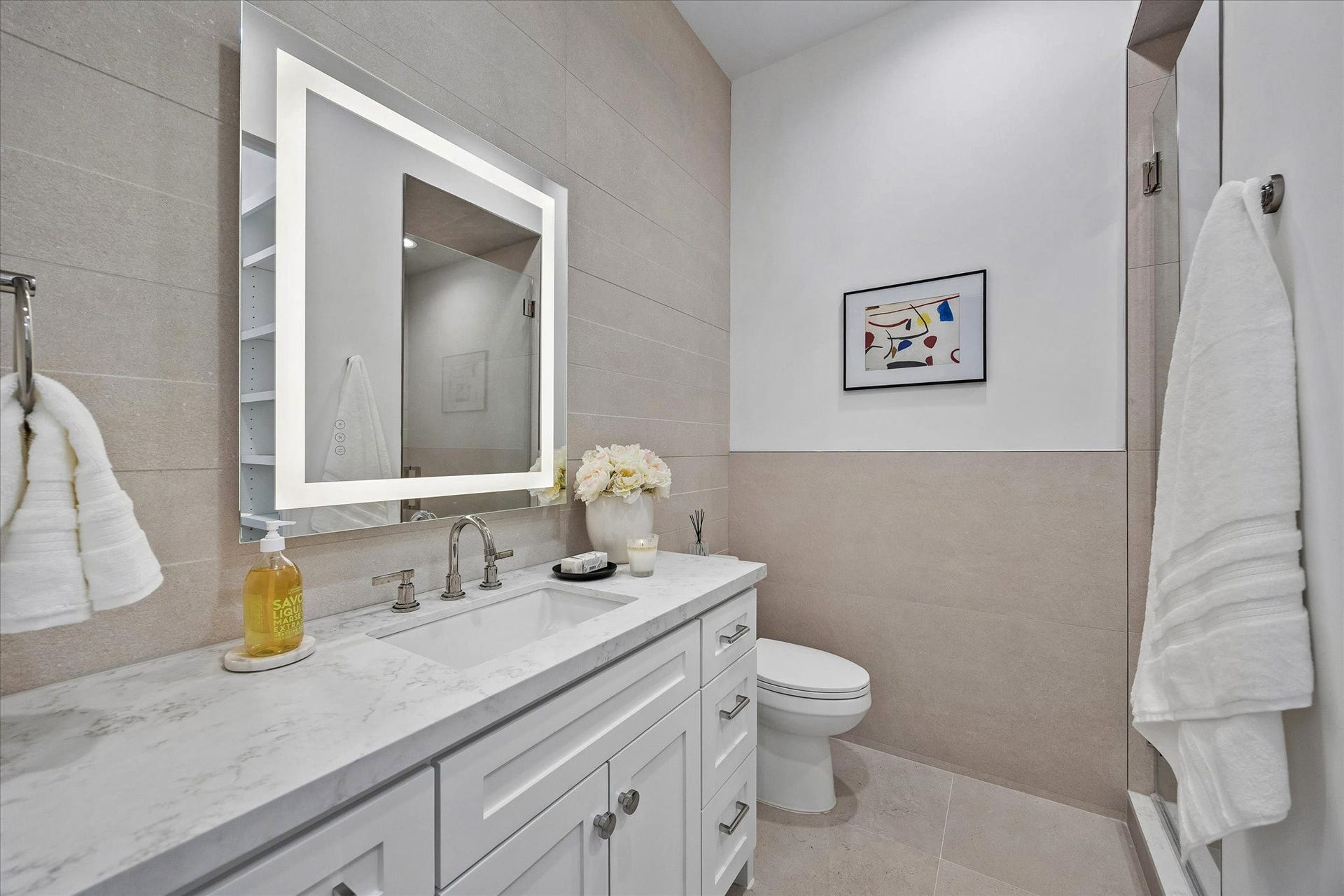 [Secondary Ensuite Bath] All three secondary bedrooms have ensuite  bathrooms with abundant storage.