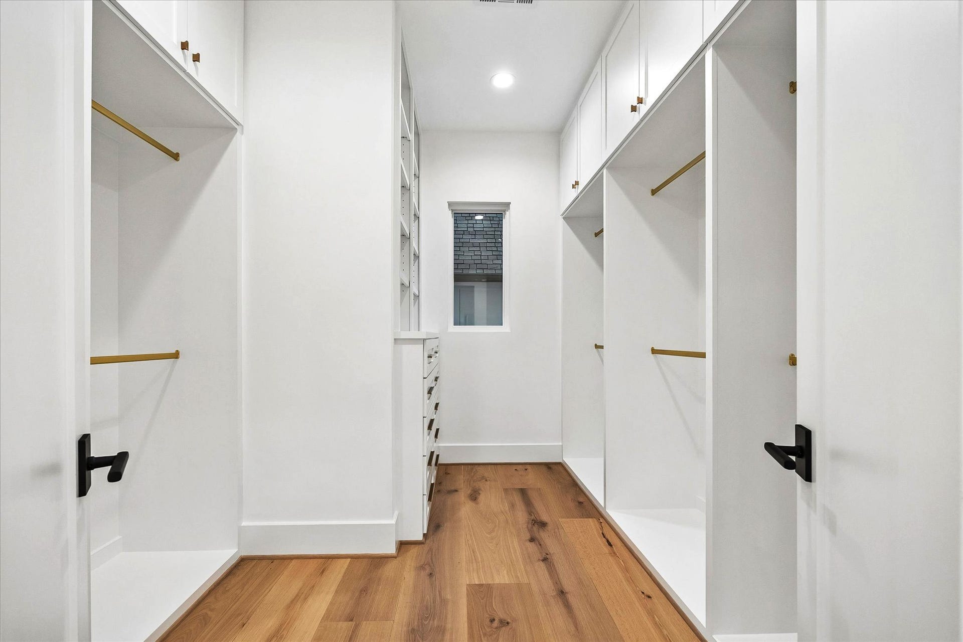 4230 Riley Street, Houston, TX 77005 The primary closet has ample hanging space and built-in accessories storage.