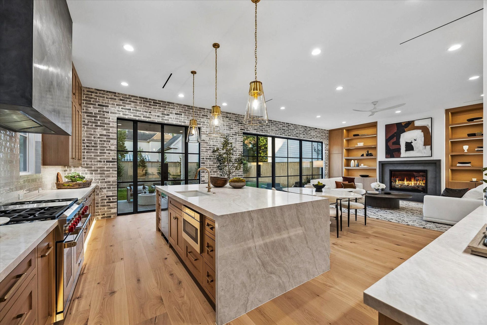 [Kitchen] The kitchen showstopper is the expansive island with seating and storage. Has pendant, recessed and under cabinet lighting. Features Subzero fridge/Wolf range/oven.