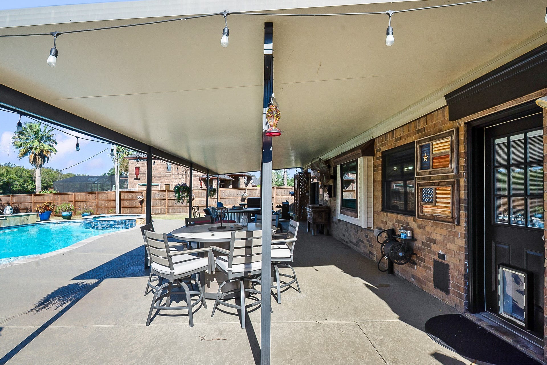 928 Oleander Street, Lake Jackson, TX 77566 Experience outdoor living at its finest with a spacious 988 sq. ft. covered patio, perfect for dining and relaxing by the sparkling pool.