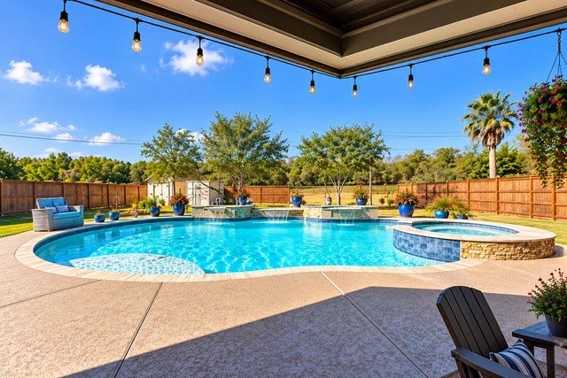 928 Oleander Street, Lake Jackson, TX 77566 Experience resort-style living with this stunning backyard oasis, featuring a sparkling heated pool, relaxing spa, and a spacious patio perfect for entertaining.