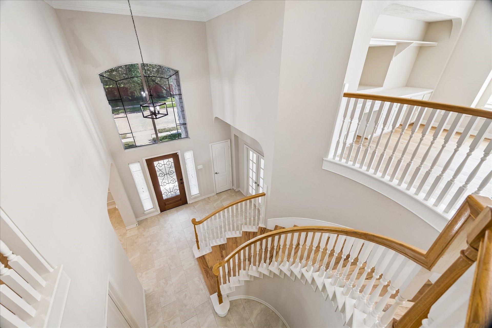 A stunning view from atop the sweeping curved staircase.