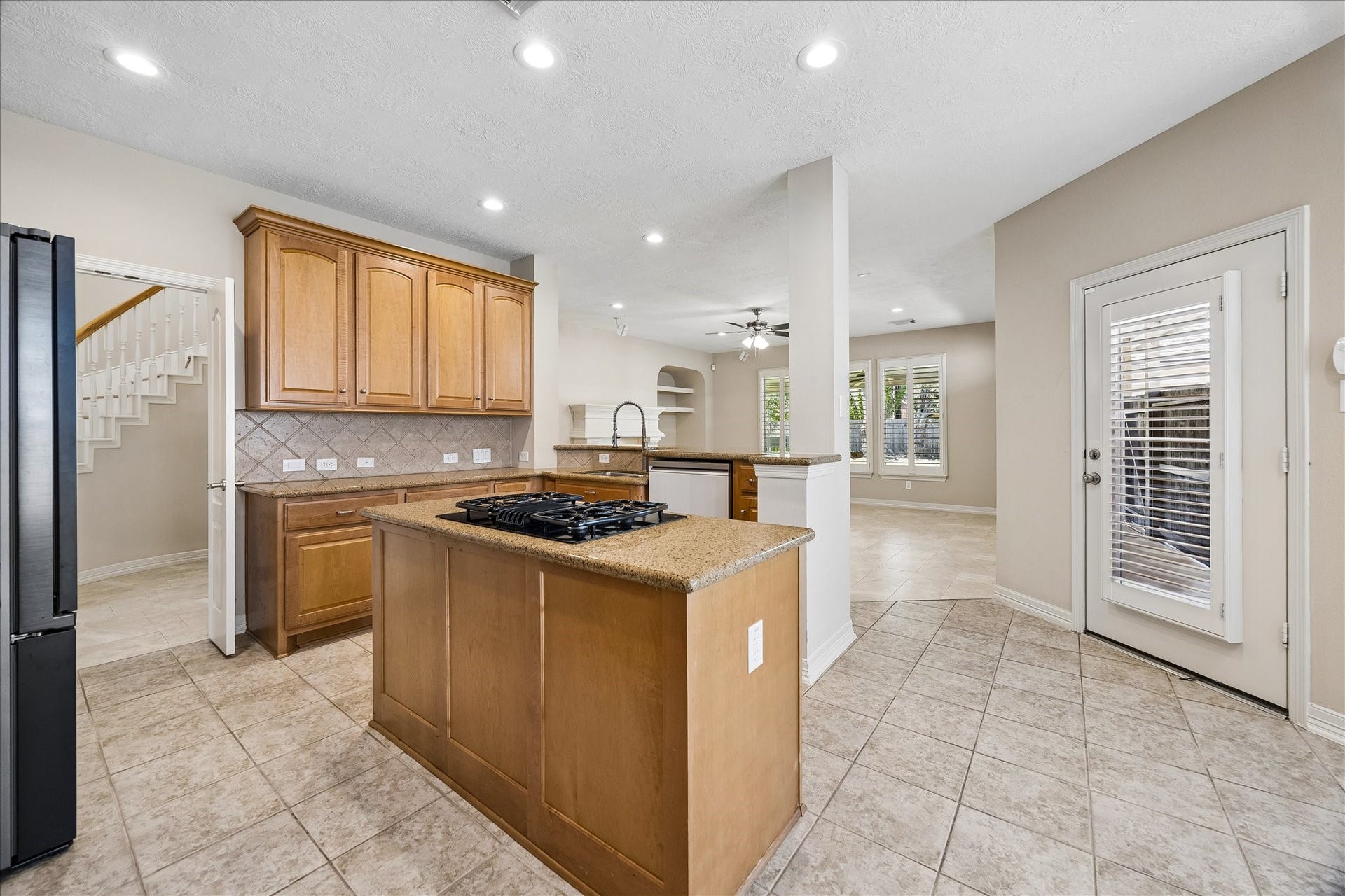 Overlooking the breakfast and family rooms, the kitchen is the heart of this home, and the chef will always be part of the conversation here.