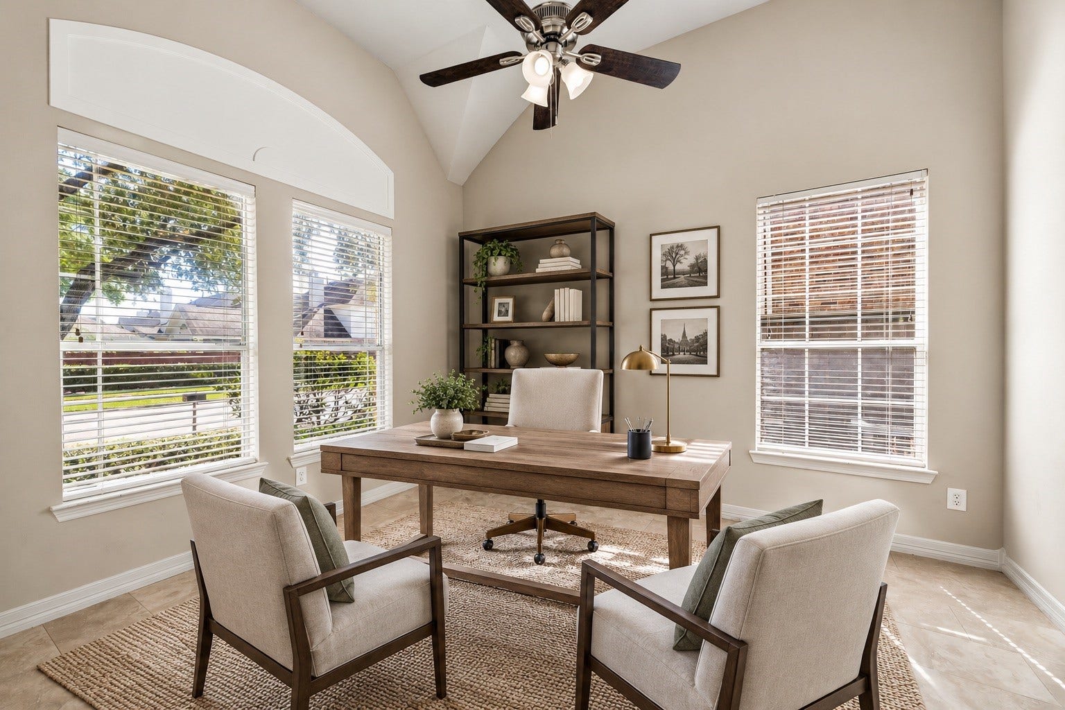 French doors open from the entry to the study, offering a quiet retreat. The study has a high vaulted ceiling, a cooling fan and large windows. Photo has been virtually staged.