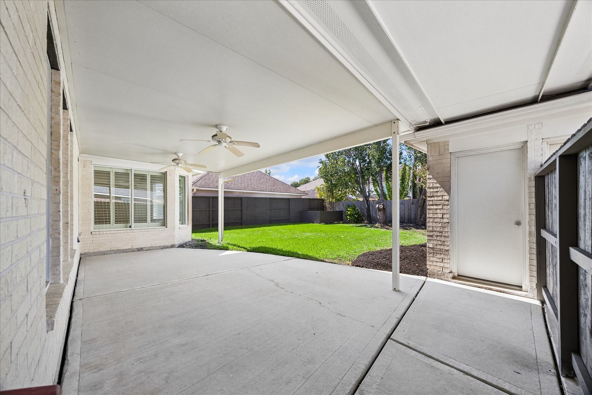 The addition of the extended covered patio. Whether entertaining for many or enjoying a good book as one, you'll find maximum comfort here.