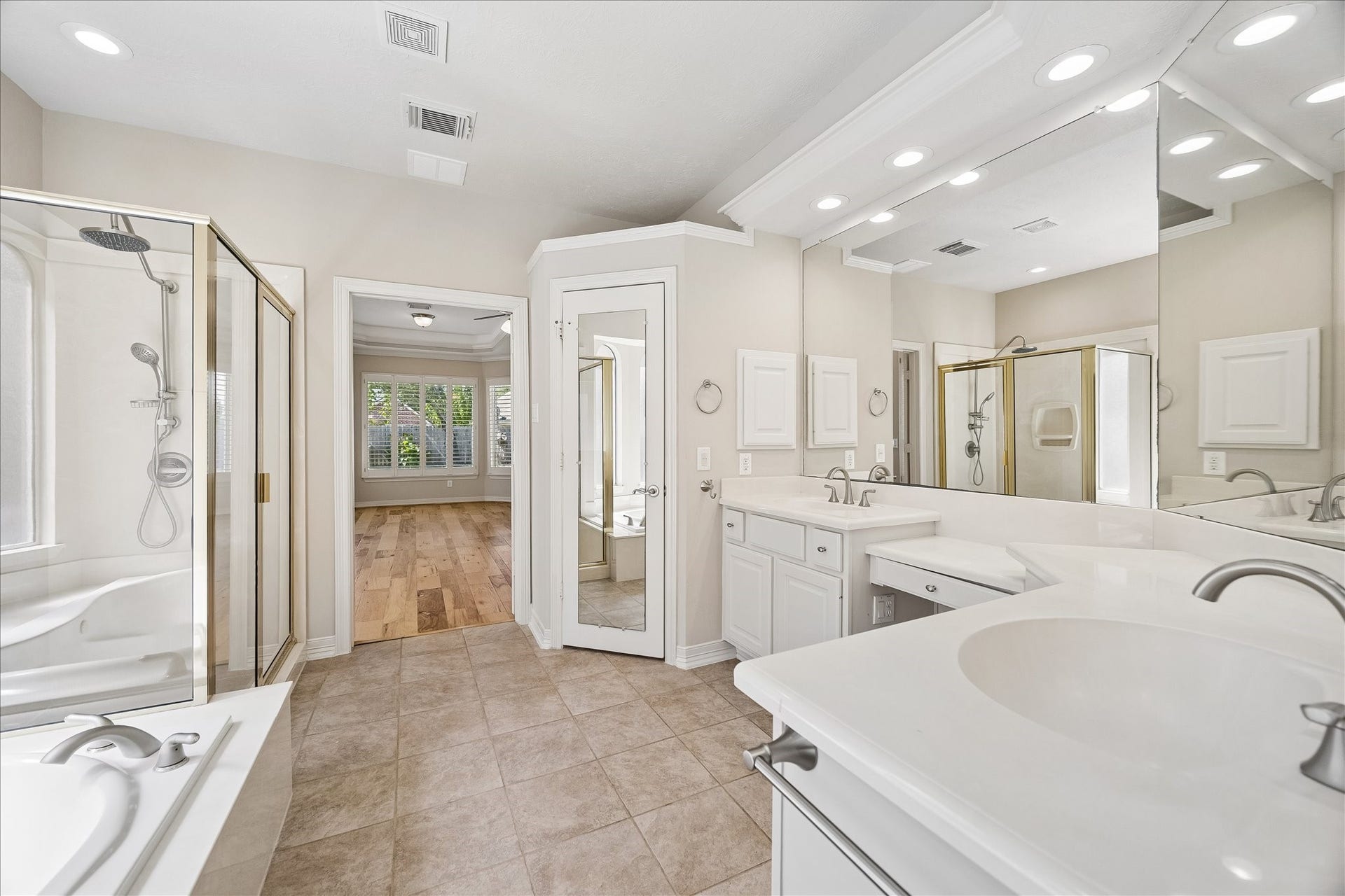 Another view of the ensuite with dual vanities and private water closet.