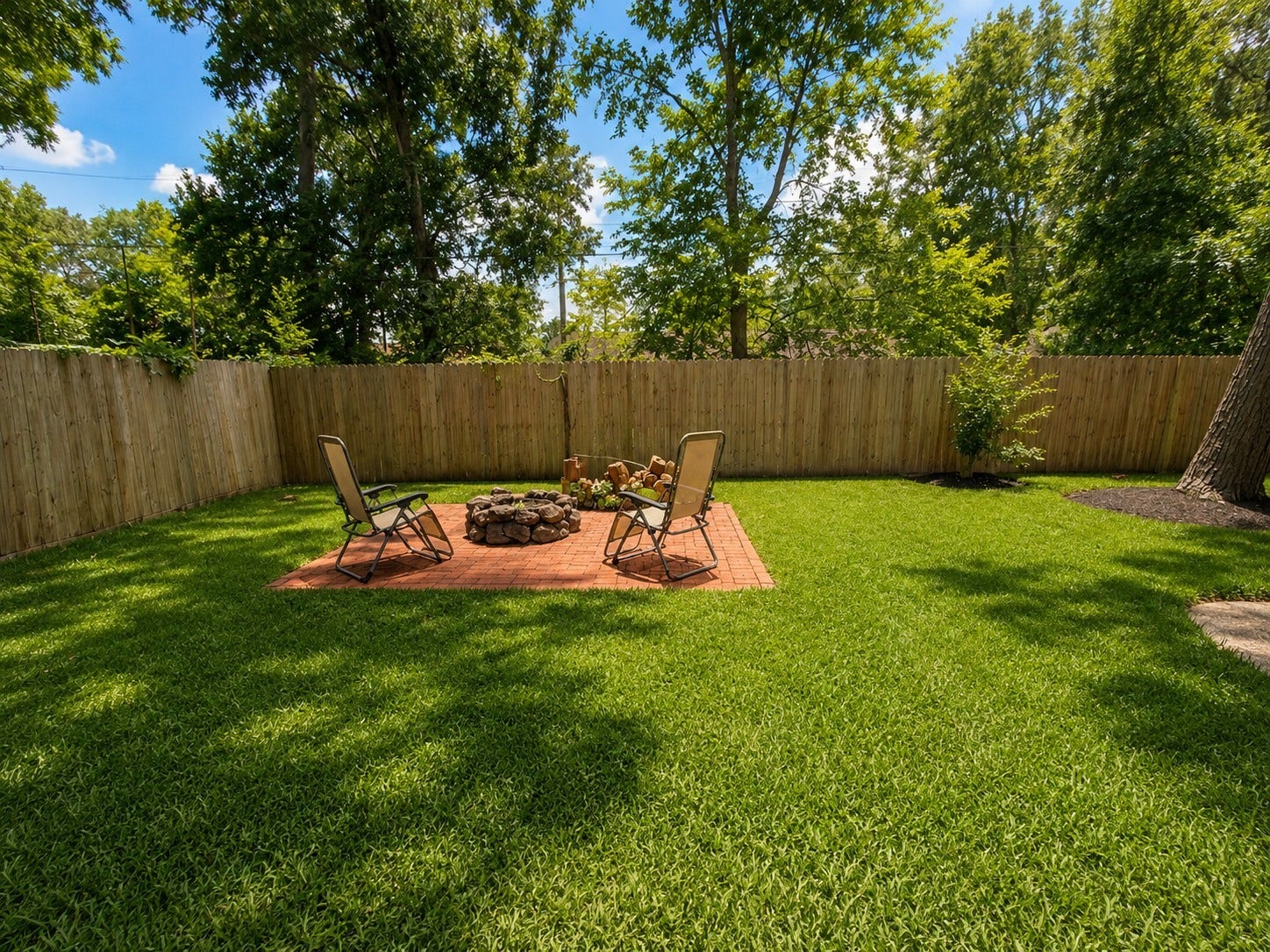 3004 Woodland Drive, Dickinson, TX 77539 Back yard fire pit.