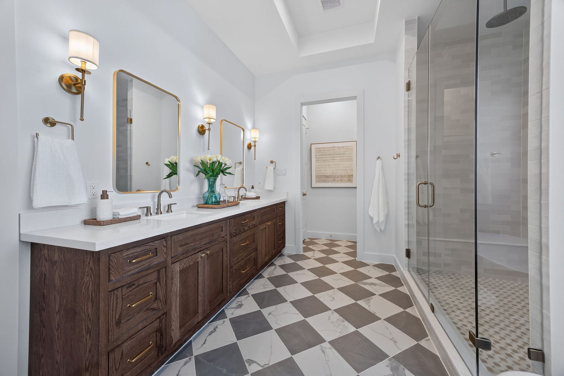 1726 Saxon Drive, Houston, TX 77018 A polished mix of natural textures in this primary bathroom create a spa-like atmosphere.