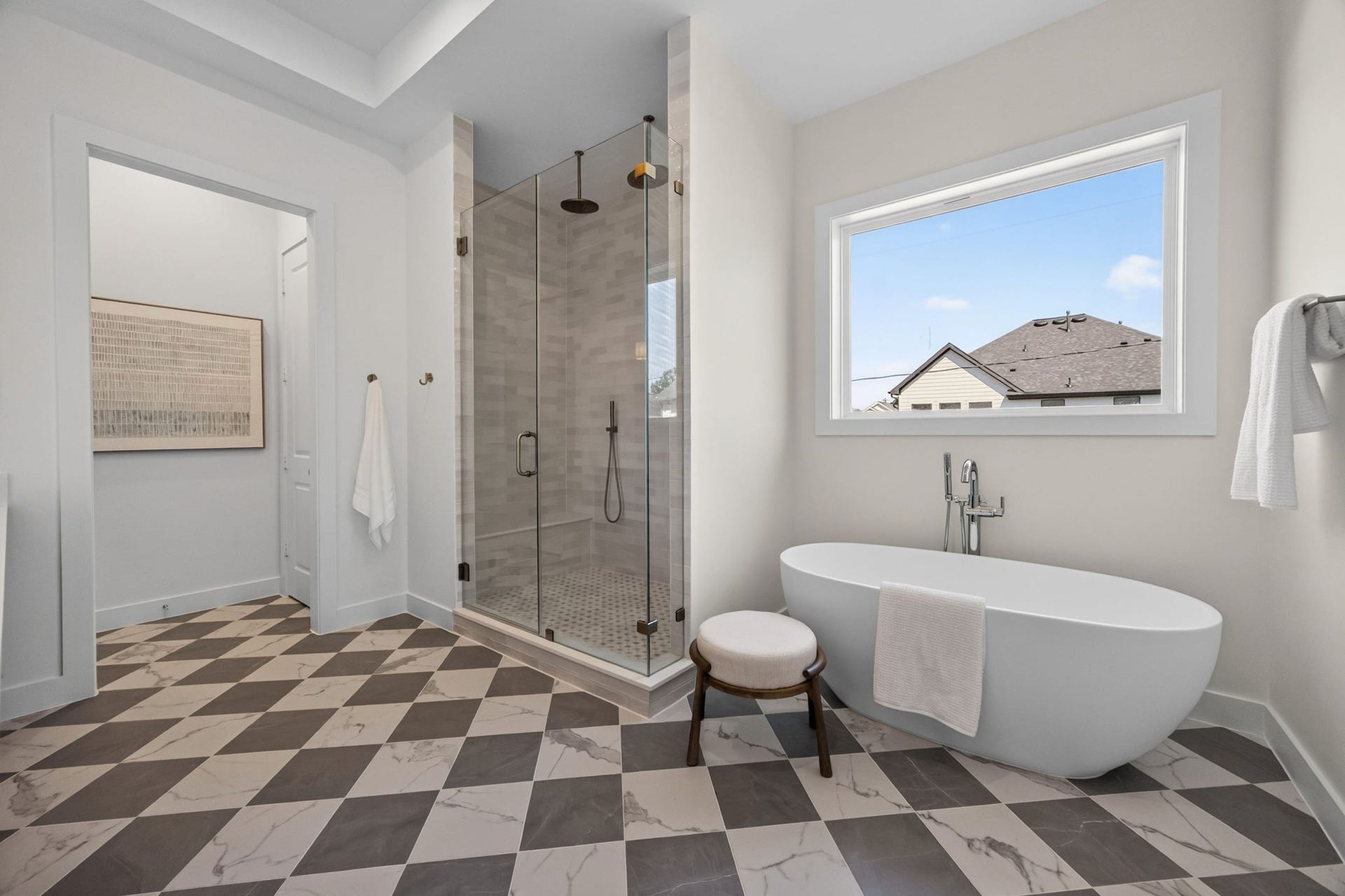 1726 Saxon Drive, Houston, TX 77018 The elegant primary bathroom offers a large shower, soaking tub, double sinks, and private WC.