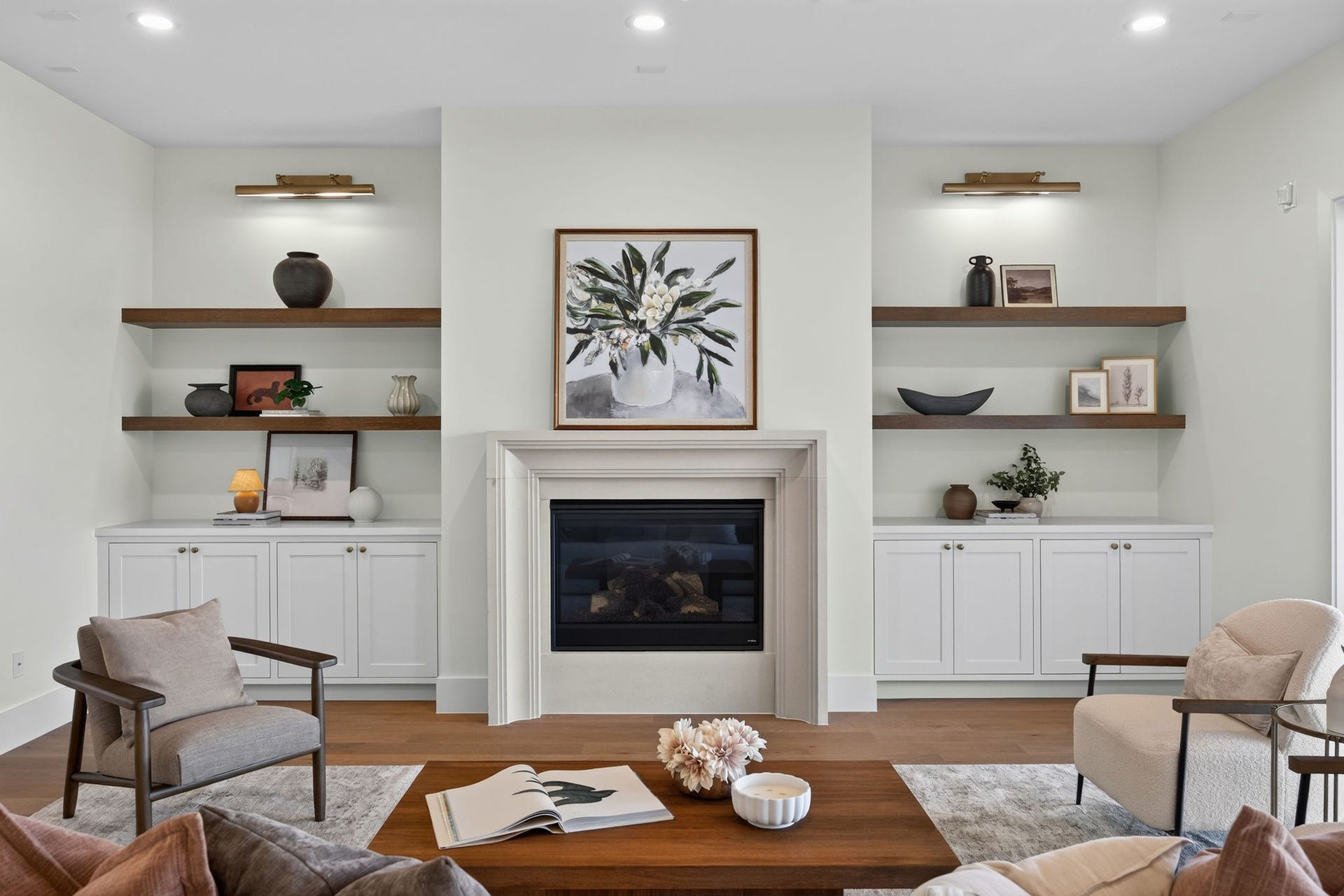 1726 Saxon Drive, Houston, TX 77018 The inviting living room features a beautiful fireplace flanked by custom built-ins, floating wood shelves, and thoughtfully selected finishes.