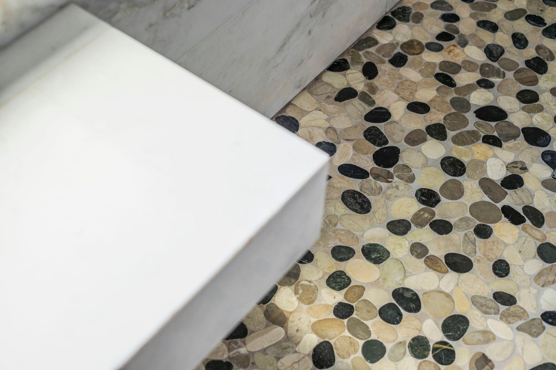 19519 Arbor Lodge Drive, Cypress, TX 77433 Pebble stone floor adds a spa-like touch to this luxurious primary bathroom.