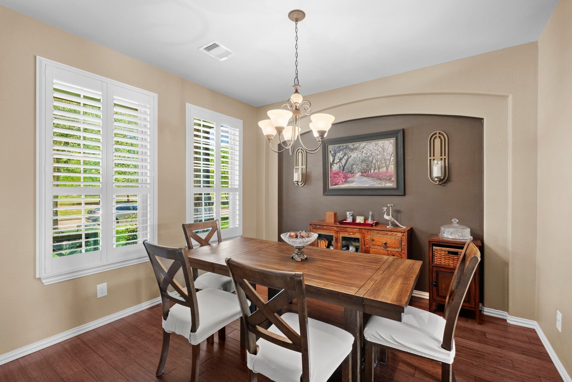 19519 Arbor Lodge Drive, Cypress, TX 77433 Elegant formal dining room with plantation shutters & wood floors overlook the front yard.