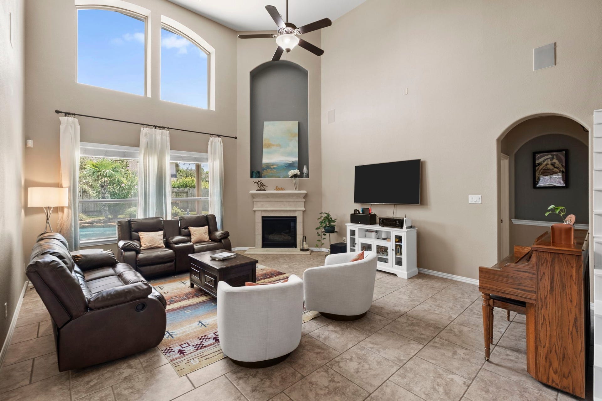 19519 Arbor Lodge Drive, Cypress, TX 77433 Spacious two story family room with lovely backyard views offering plenty of natural light.