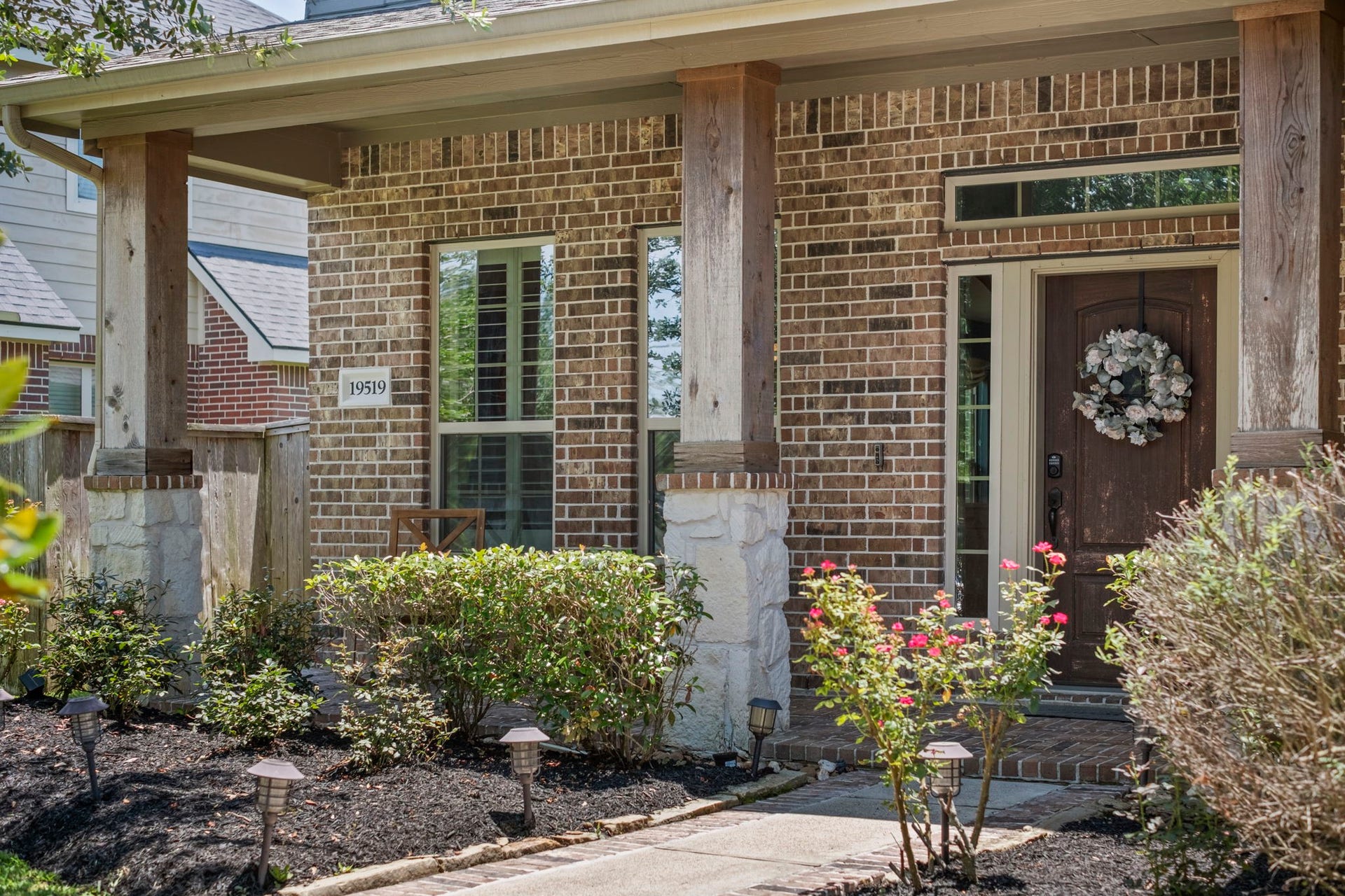19519 Arbor Lodge Drive, Cypress, TX 77433 Charming front porch with wood & stone columns add a nice touch to this inviting home.