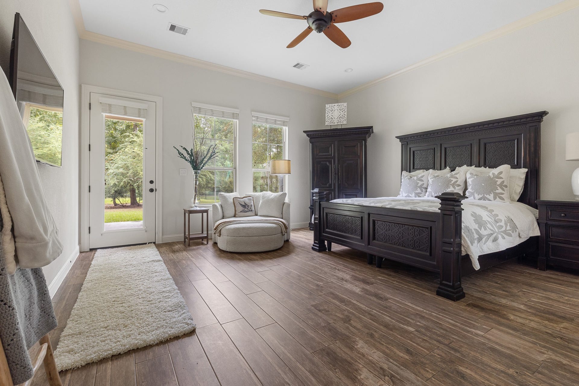 12134 S Tara Plantation Drive, Tomball, TX 77375 Primary bedroom with sitting area, access to backyard patio, ensuite bathroom and custom walk-in closet