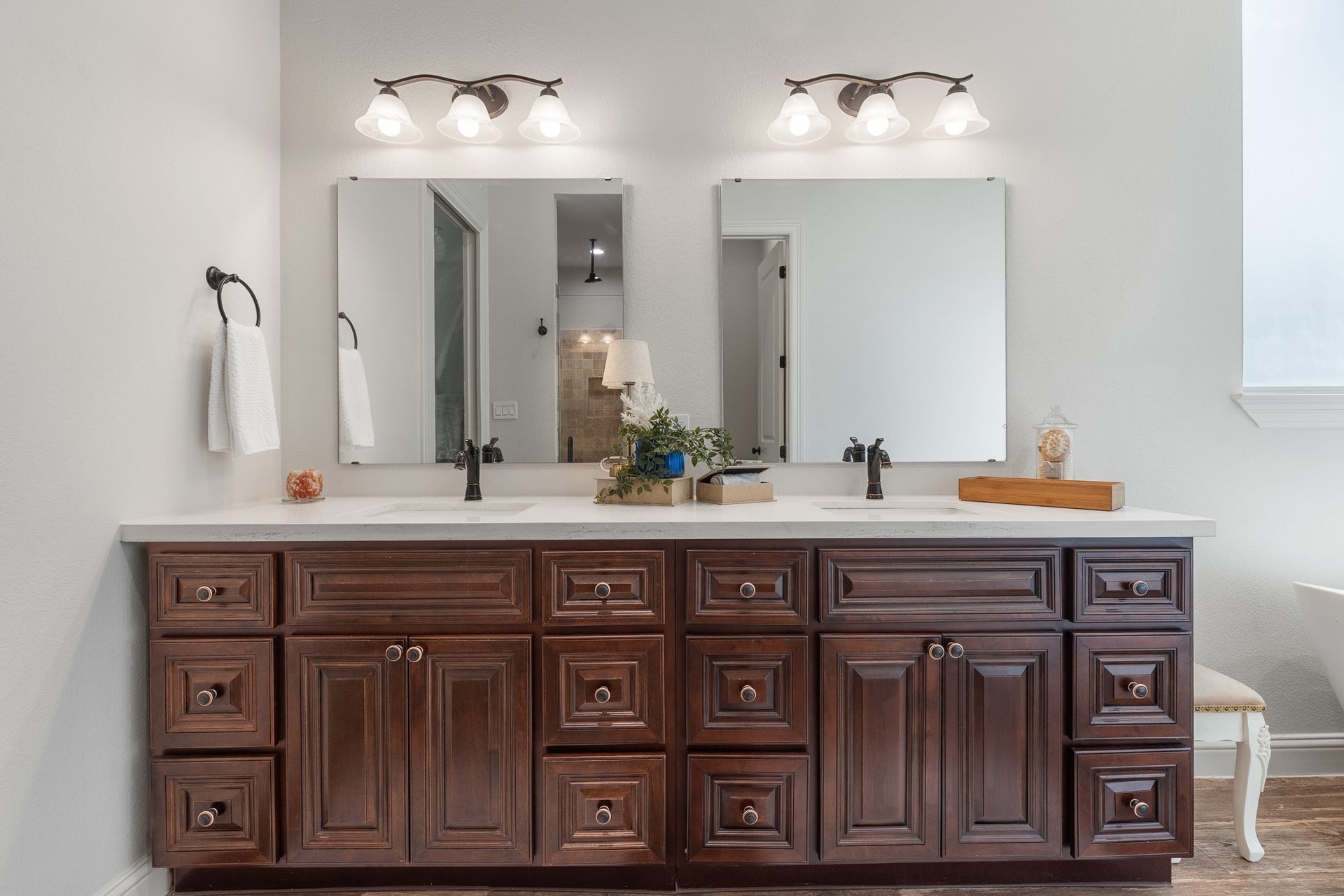 12134 S Tara Plantation Drive, Tomball, TX 77375 Primary bathroom with custom maple cabinetry throughout all bathrooms.