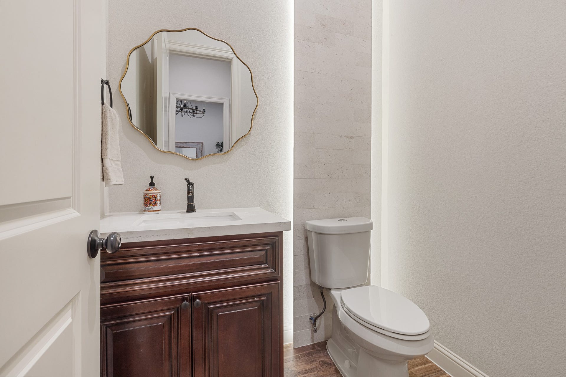 12134 S Tara Plantation Drive, Tomball, TX 77375 Half bathroom with custom maple vanity.