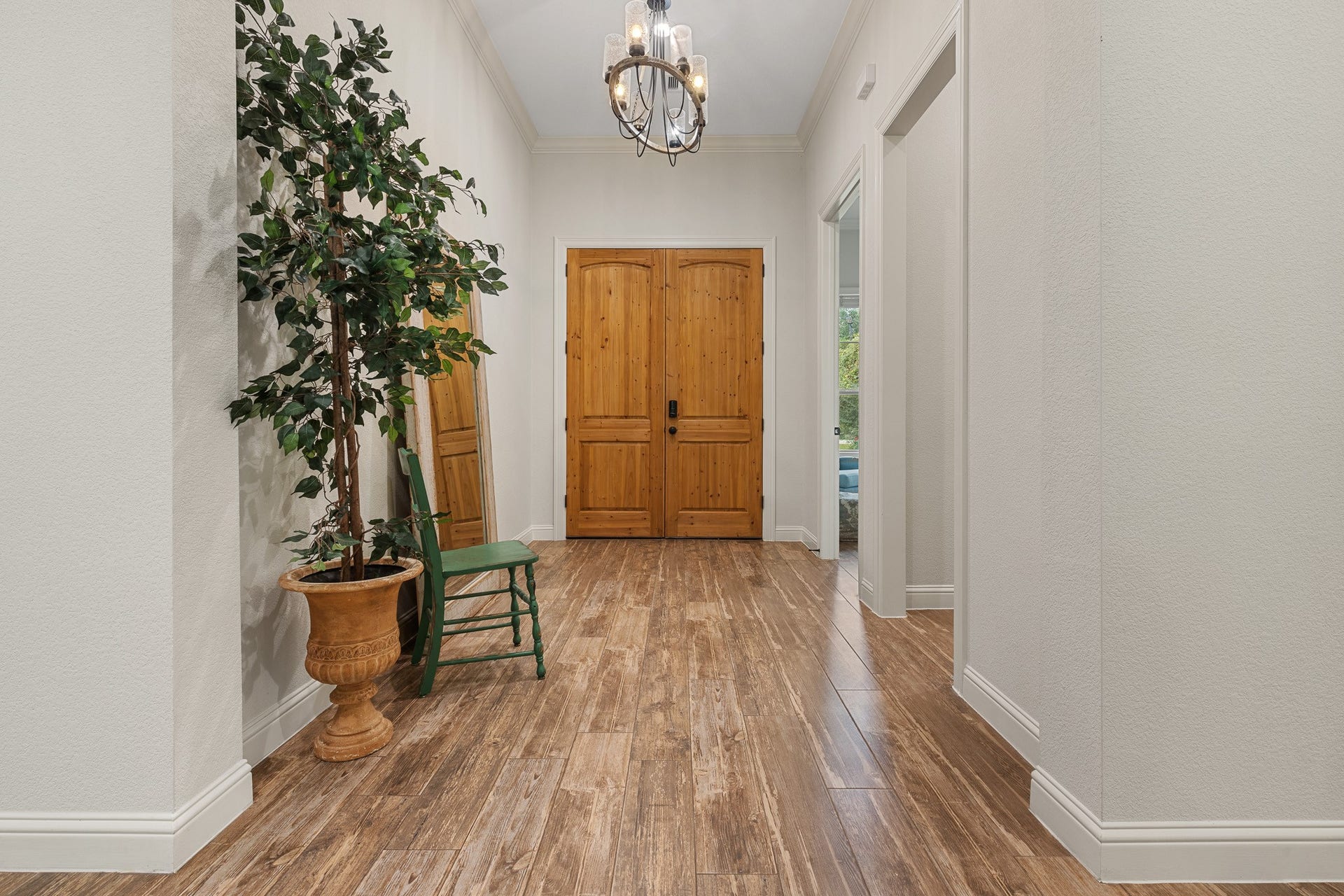 12134 S Tara Plantation Drive, Tomball, TX 77375 Wood doors at the front entry, wood look porcelain tile throughout.
