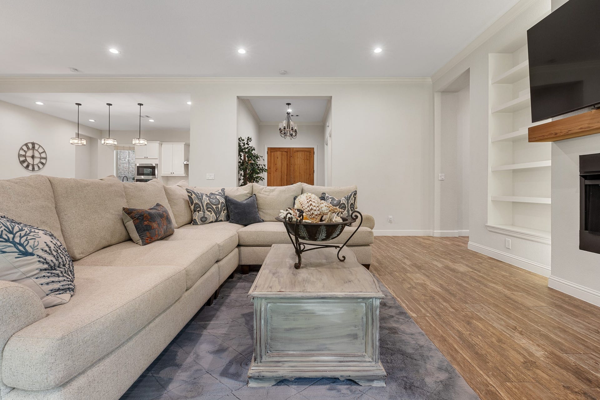 12134 S Tara Plantation Drive, Tomball, TX 77375 Living room with gas fireplace, recessed lighting, built-ins.