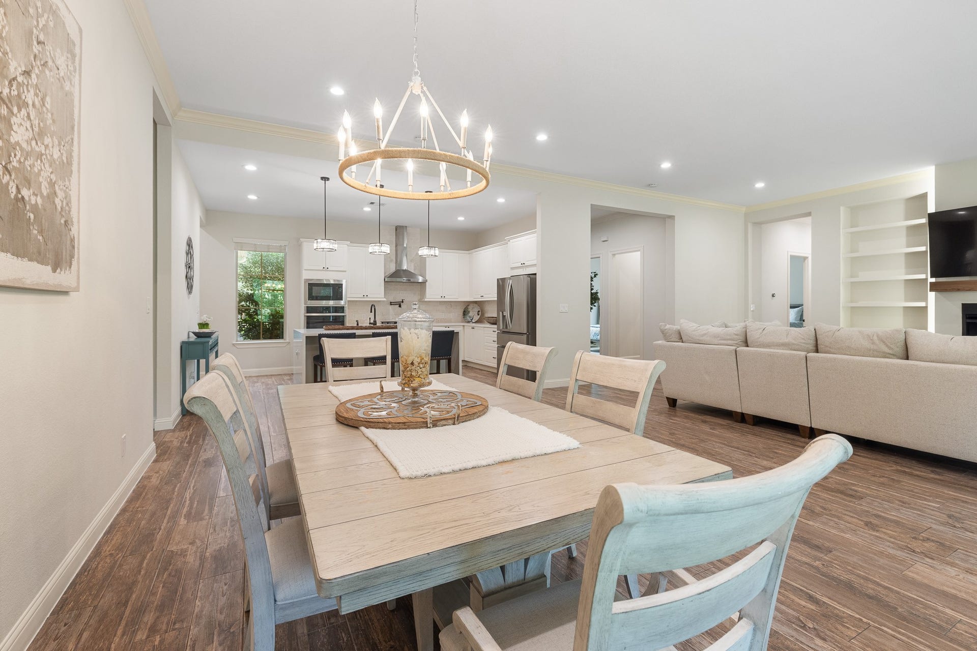 12134 S Tara Plantation Drive, Tomball, TX 77375 Dining room with Covington 12 - Light Dimmable Kitchen Island Wagon Wheel Chandelier