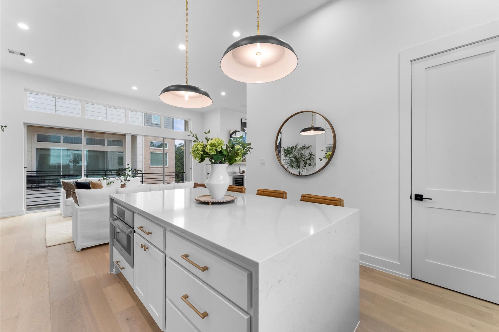 Generous island with beautiful and durable quartz countertops.