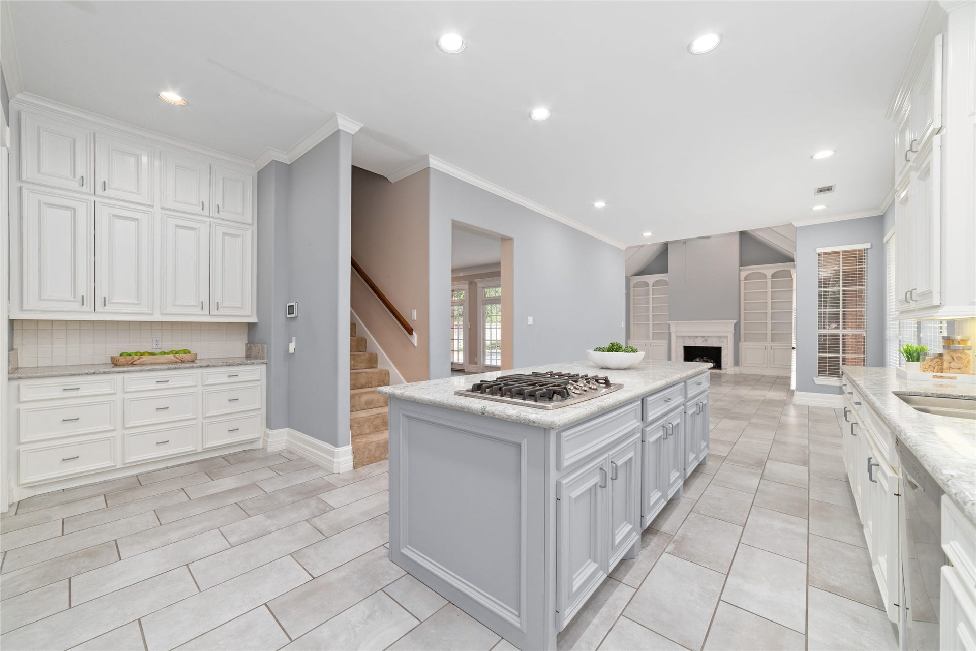 16114 Lafone Drive, Spring, TX 77379 Another view of the kitchen showcasing the up to the ceiling storage and an additional staircase to the second floor.