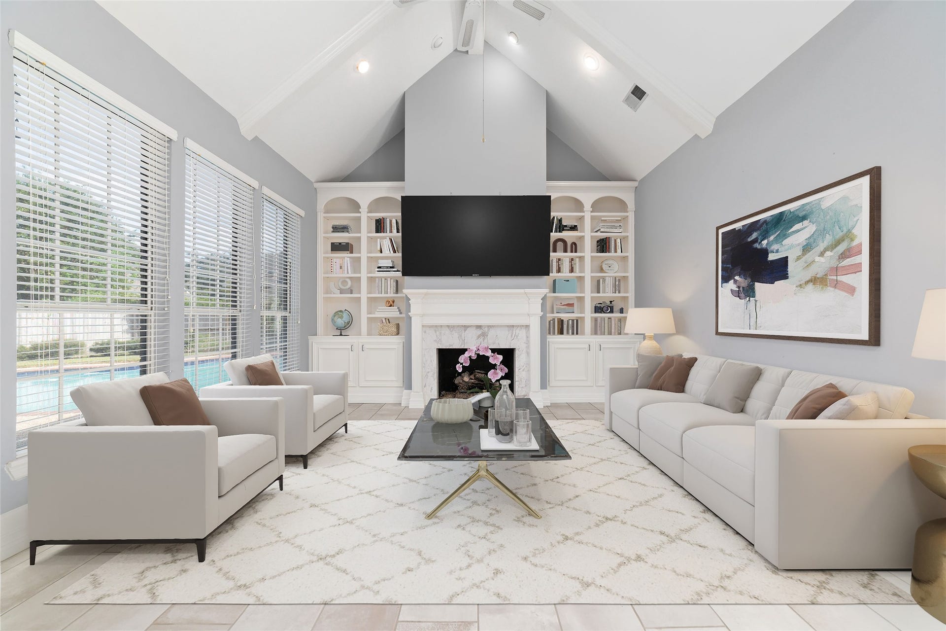 16114 Lafone Drive, Spring, TX 77379 Soaring ceilings, a fireplace and custom built-ins anchor this light filled living area overlooking the backyard and pool. Virtually Staged.
