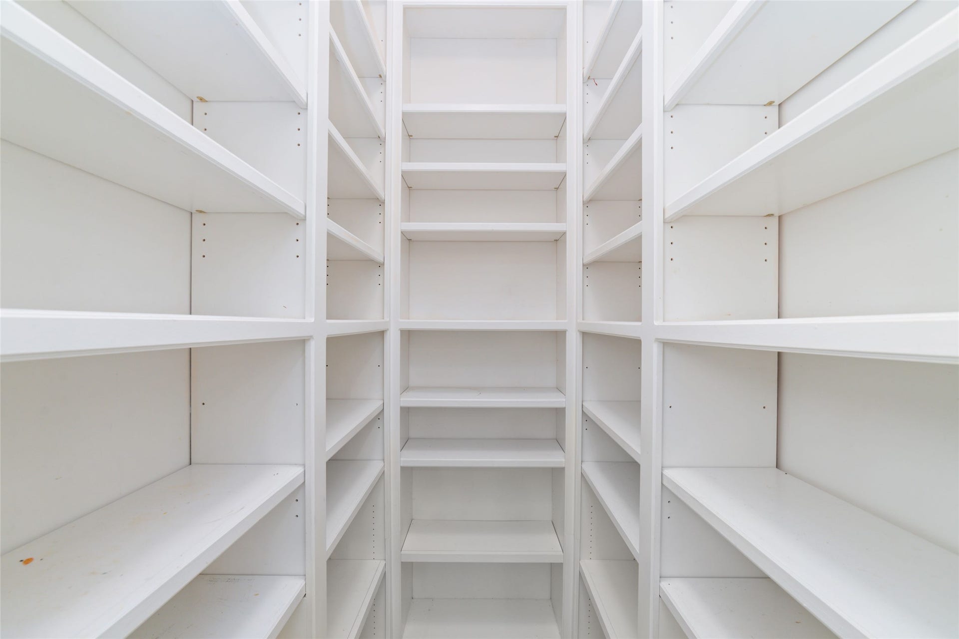 16114 Lafone Drive, Spring, TX 77379 Everyones dream...a HUGE walk-in primary closet with abundant built-in shelving and plenty of room to keep everything organized!