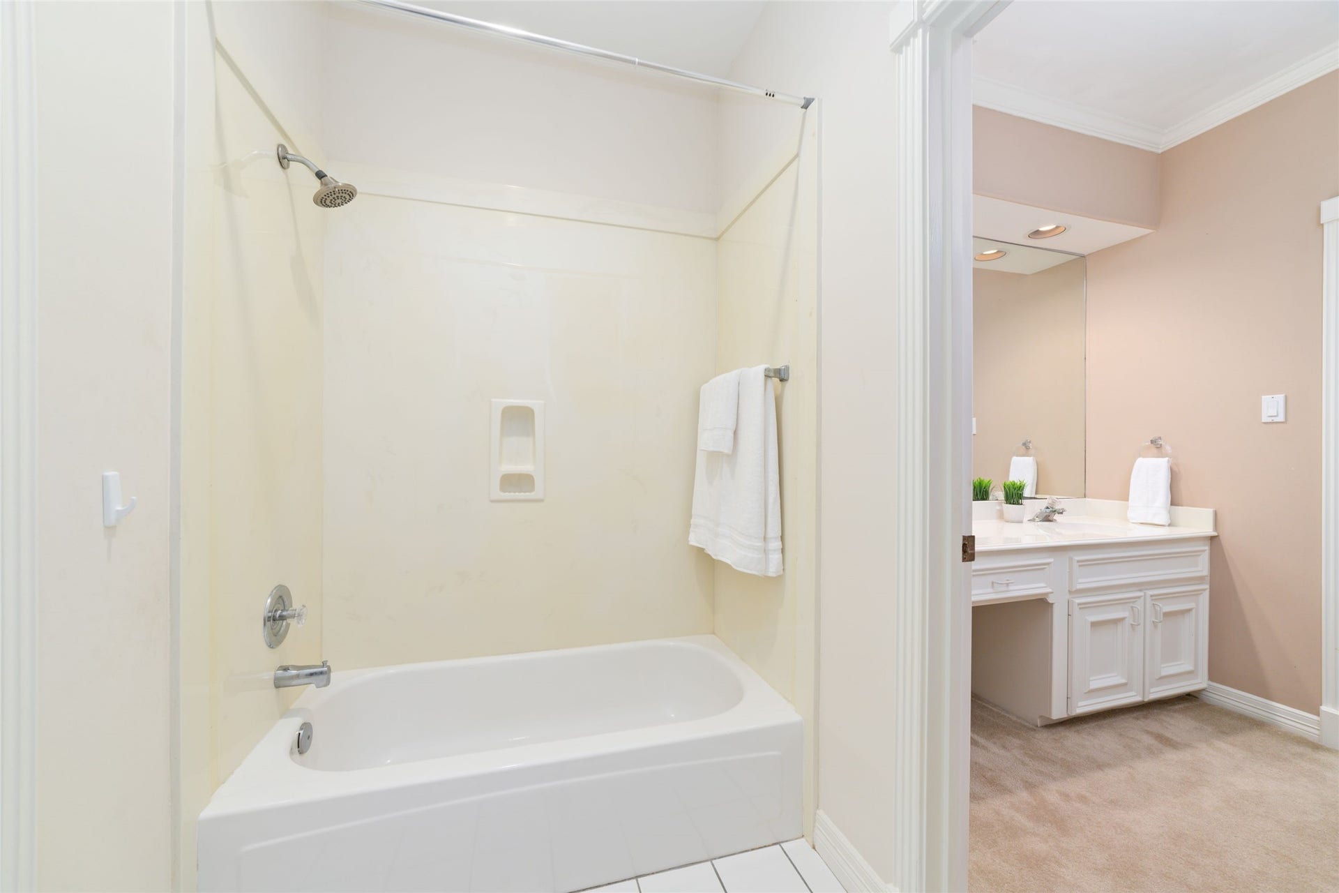 16114 Lafone Drive, Spring, TX 77379 The second Hollywood-style bathroom features its own tub/shower combination and private vanity area, offering added privacy and functionality for the adjoining bedroom.