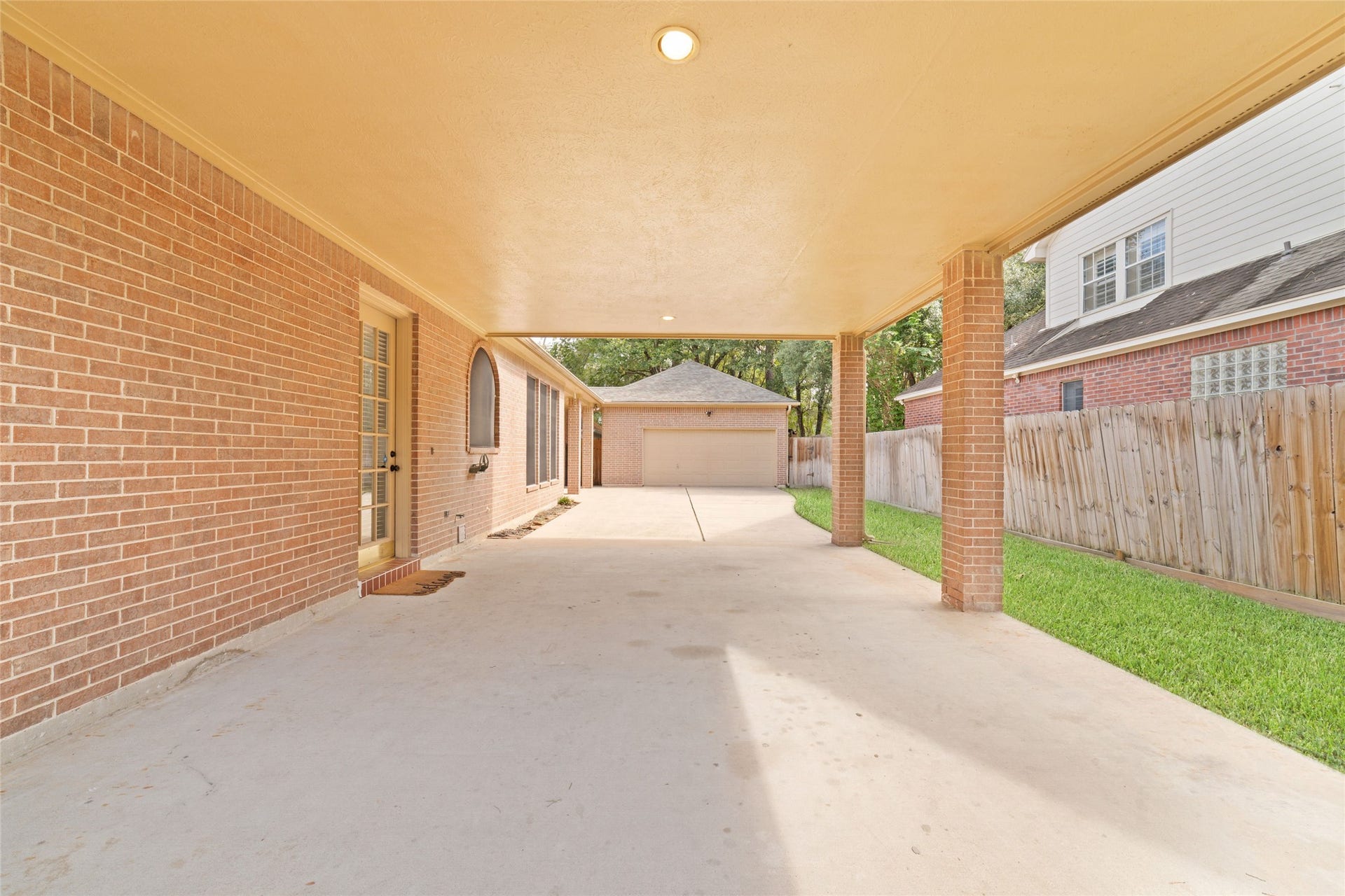 16114 Lafone Drive, Spring, TX 77379 HUGE porte-cochere provides covered parking and leads directly to the kitchen for easy grocery unloading.