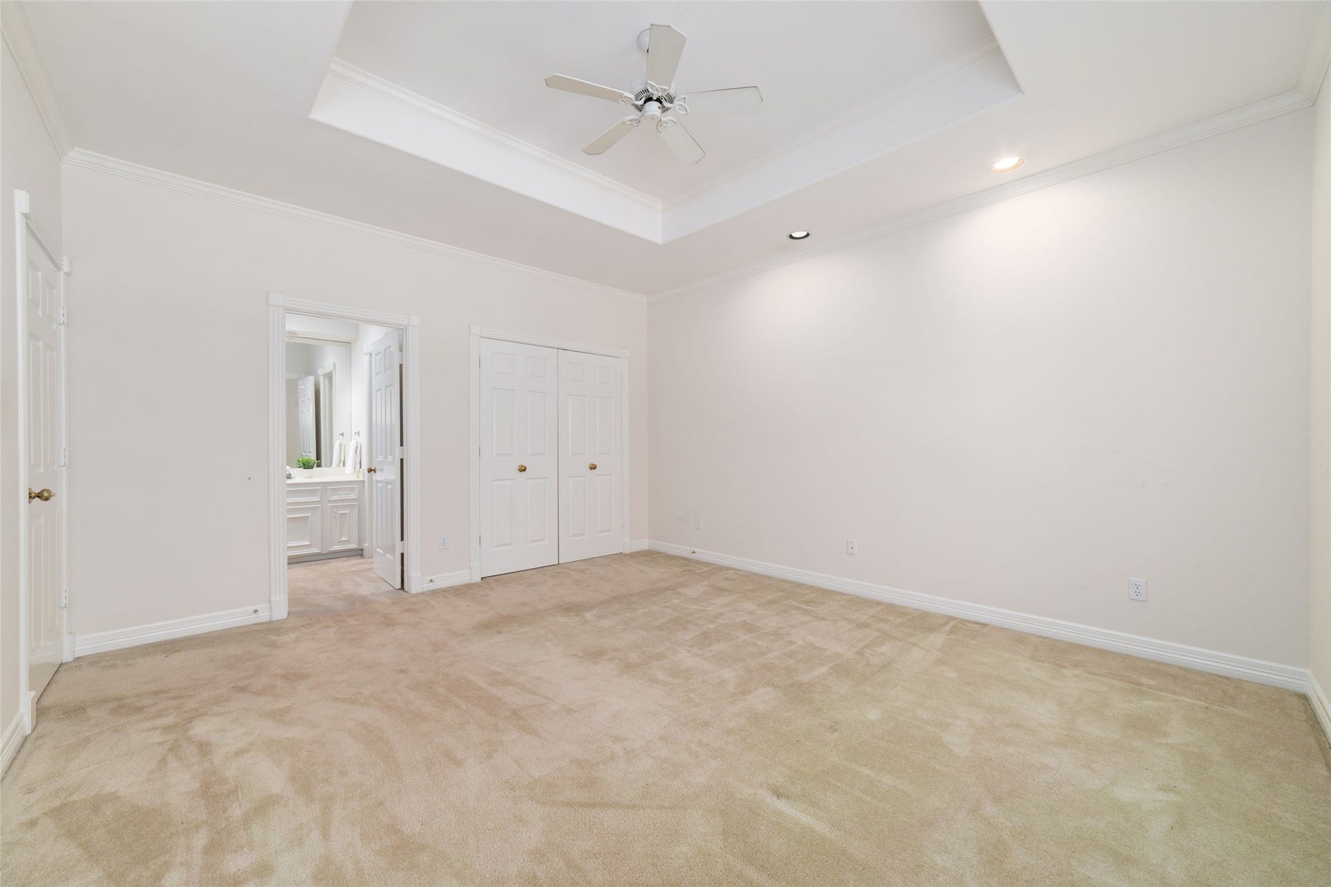 16114 Lafone Drive, Spring, TX 77379 Spacious secondary bedroom with a tray ceiling, neutral finishes and plenty of room to make the space your own.