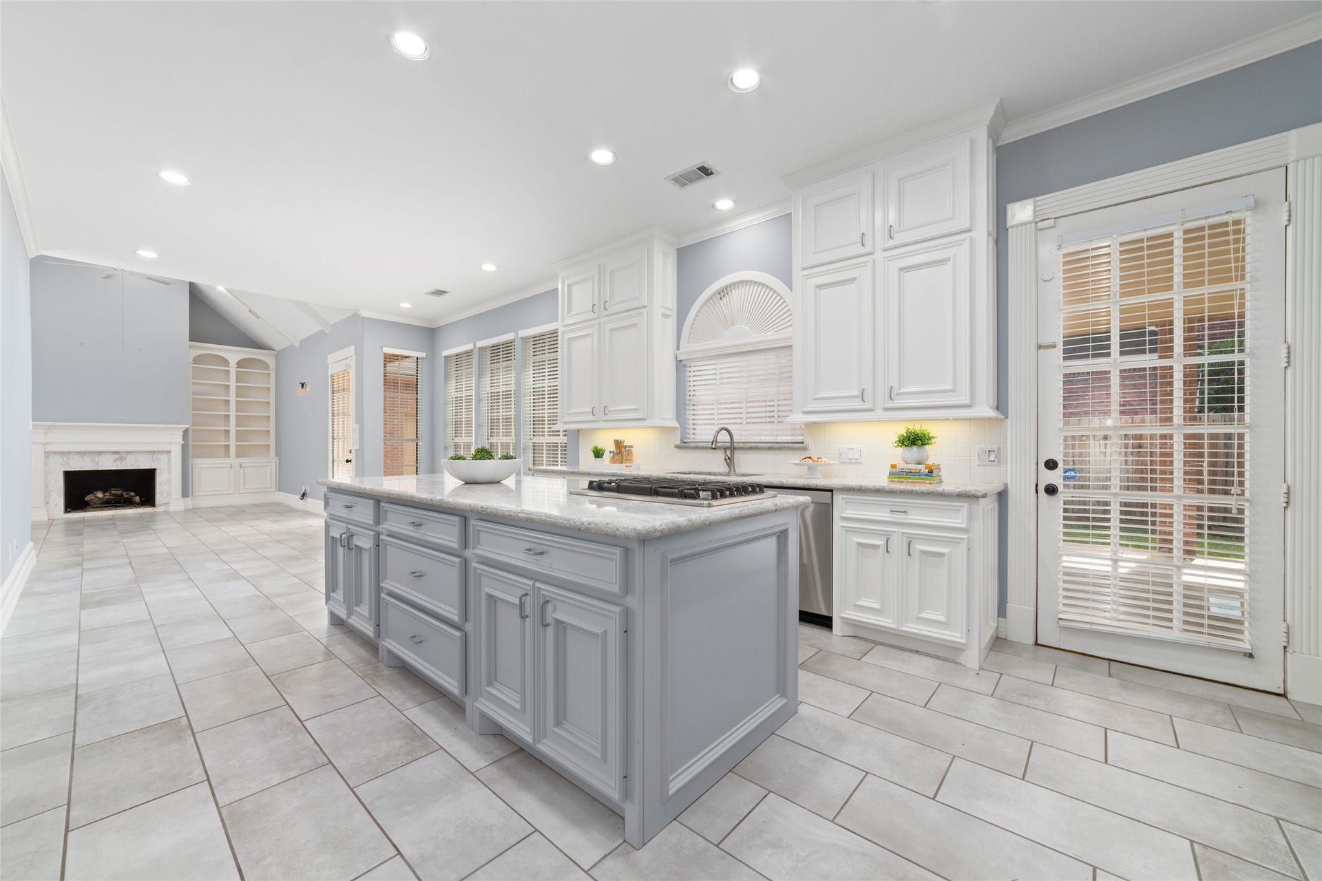 16114 Lafone Drive, Spring, TX 77379 The kitchen flows effortlessly into the living area and features an island with plenty of extra storage and a gas cooktop.