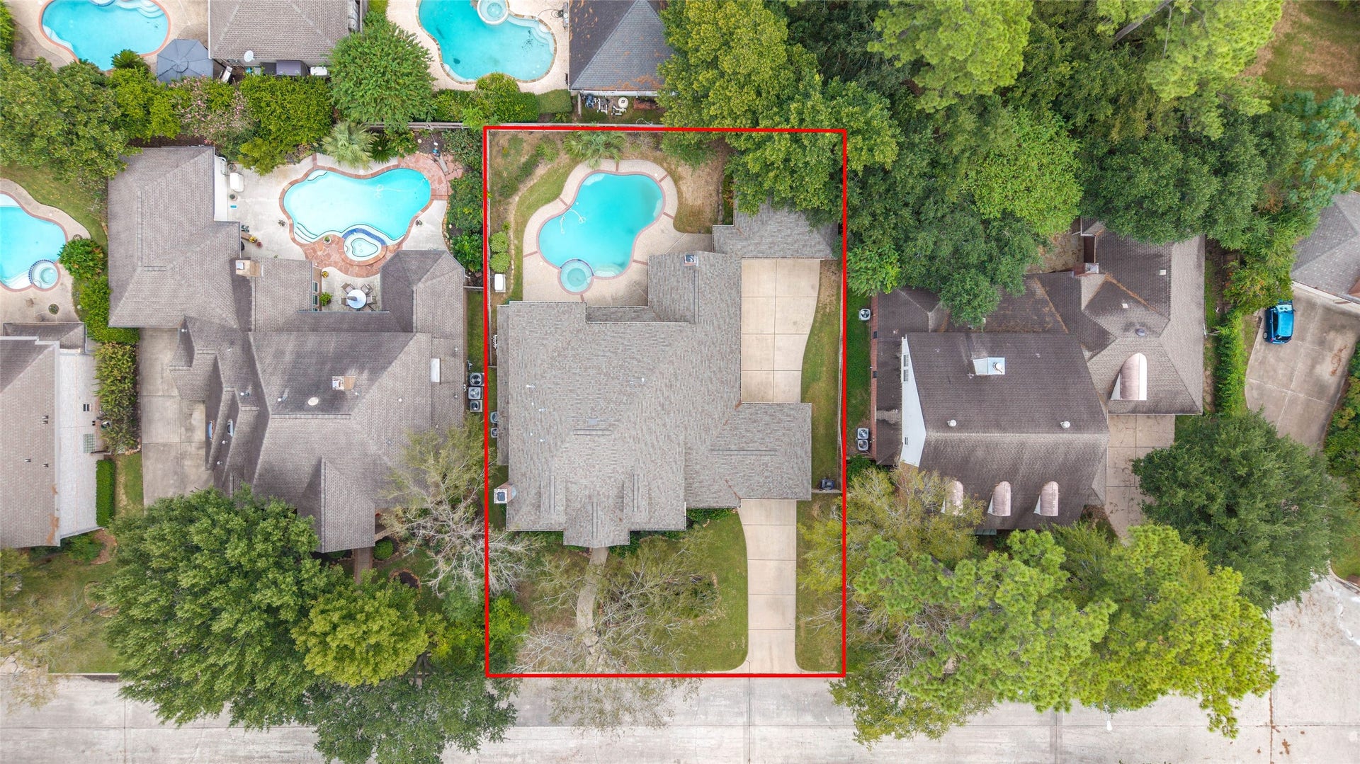 16114 Lafone Drive, Spring, TX 77379 Aerial view highlighting the home, backyard pool and surrounding mature trees.