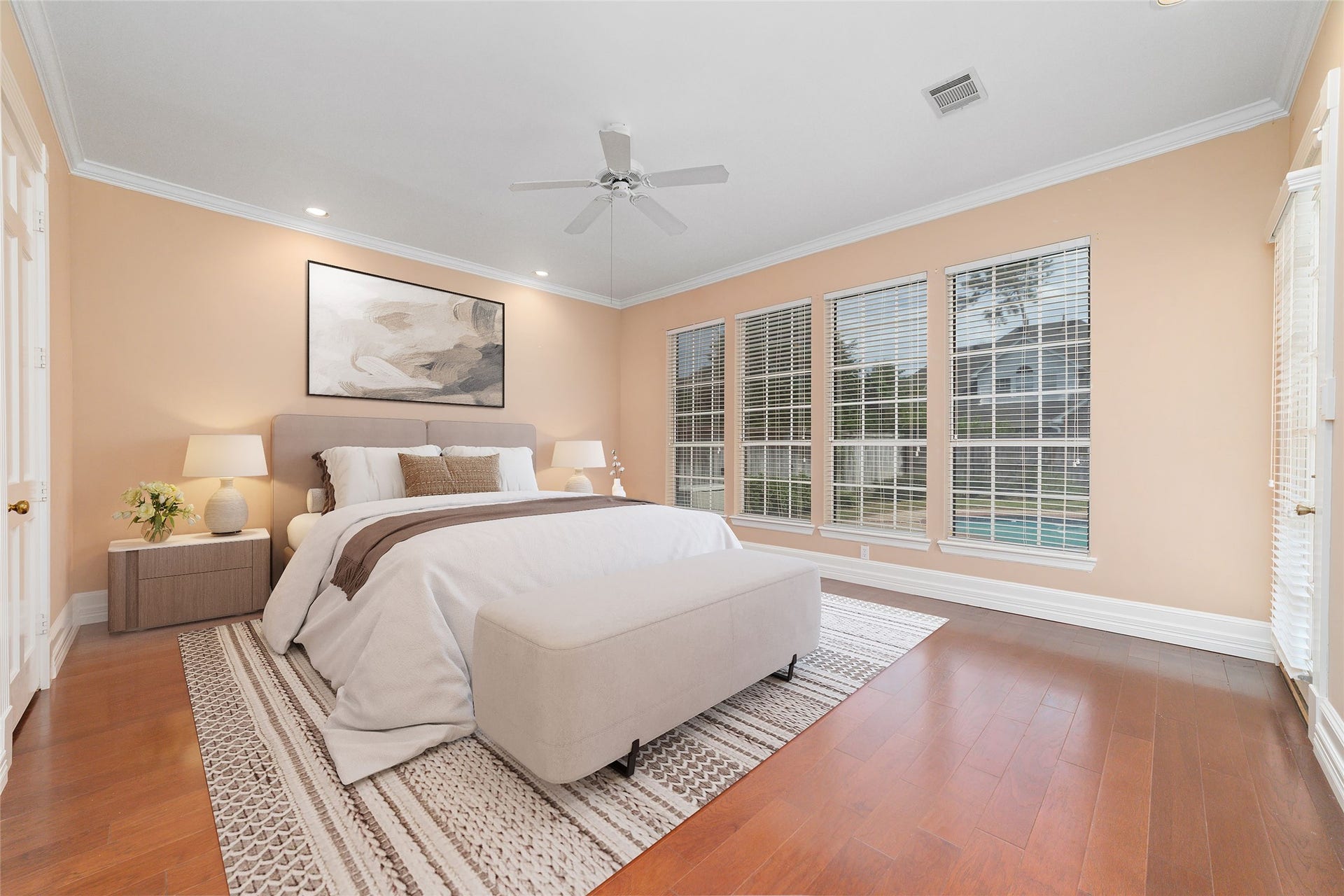16114 Lafone Drive, Spring, TX 77379 Spacious primary suite offers plenty of room for a king sized bed, larger furniture and a comfortable sitting area overlooking the backyard and pool. Virtually Staged.