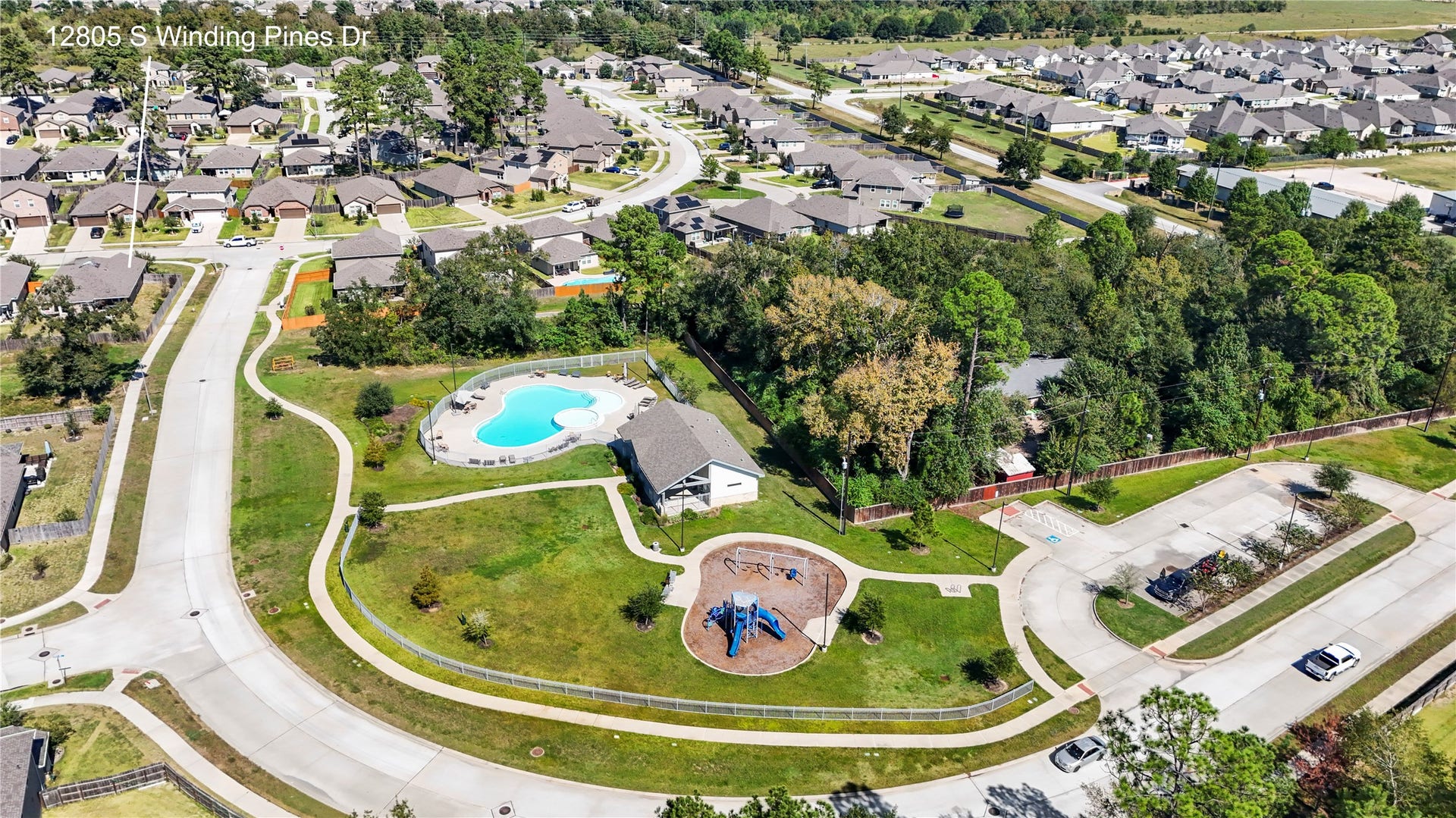 12805 S Winding Pines Drive, Tomball, TX 77375 The neighborhood pool, playground and green space are just a quick walk away.